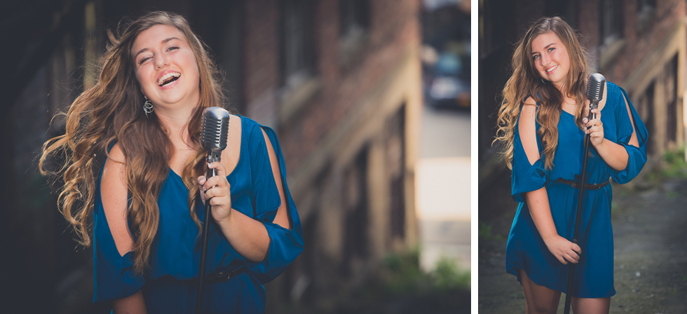 senior portrait photography of young woman laughing with microphone in industrial, edgy looking area of Jamestown, NY, a city in WNY