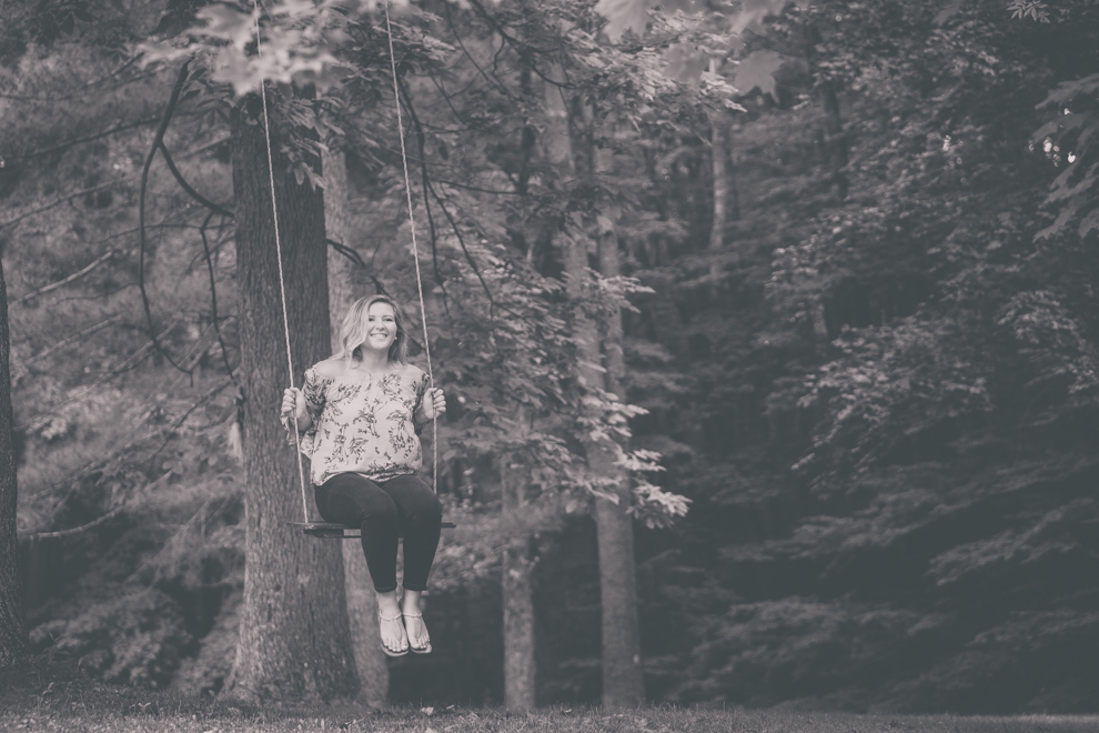 Maple Grove Senior Portrait of Alli on swing in Bemus Point, NY