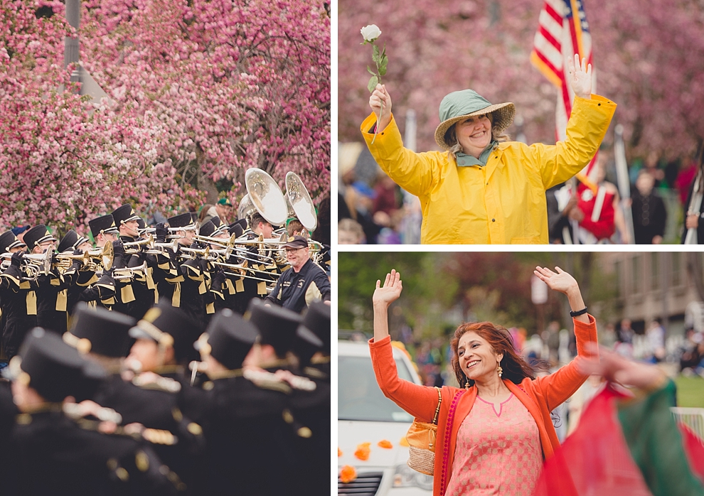 marching band and participants perform during parade in front of cherry blossoms Lilac Festival at Highland Park in Rochester, NY