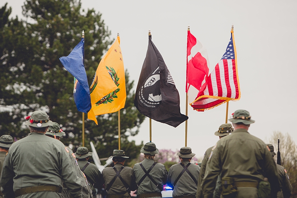 veterans march with flags during parade Lilac Festival at Highland Park in Rochester, NY