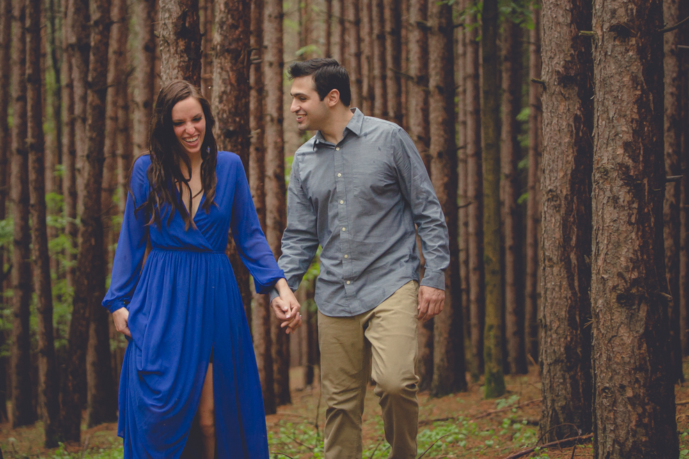 bride and groom pose for engagement photography session in forest in southern tier of western NY near Buffalo