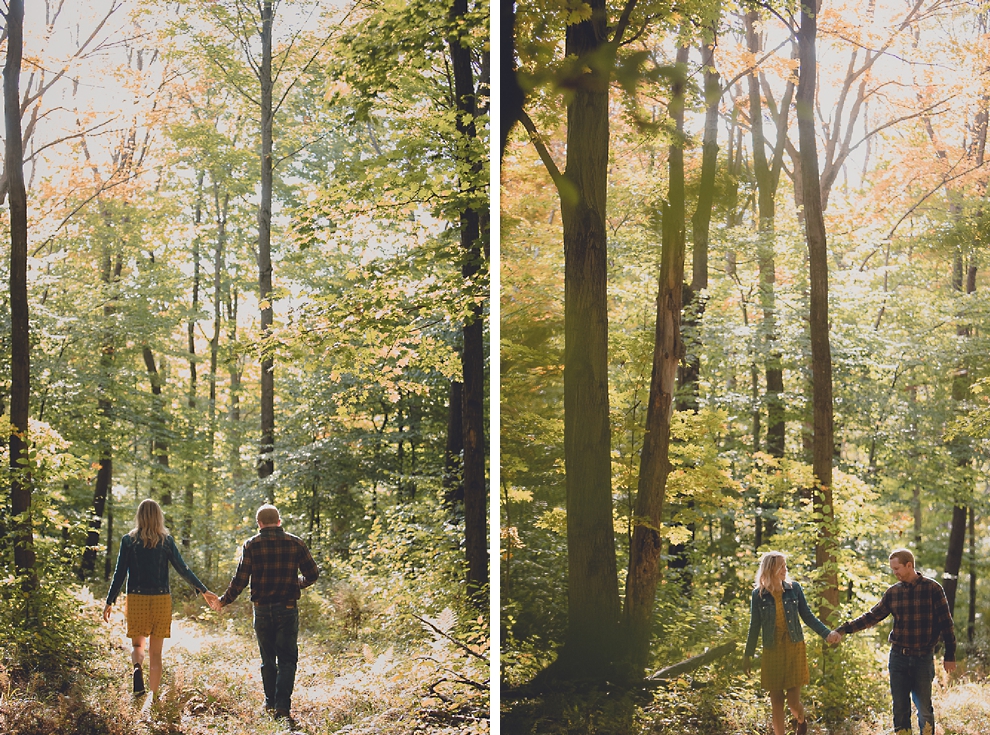 bride and groom walk while holding hands during wedding engagement photos among fall foliage at their property in Ellicottville, NY