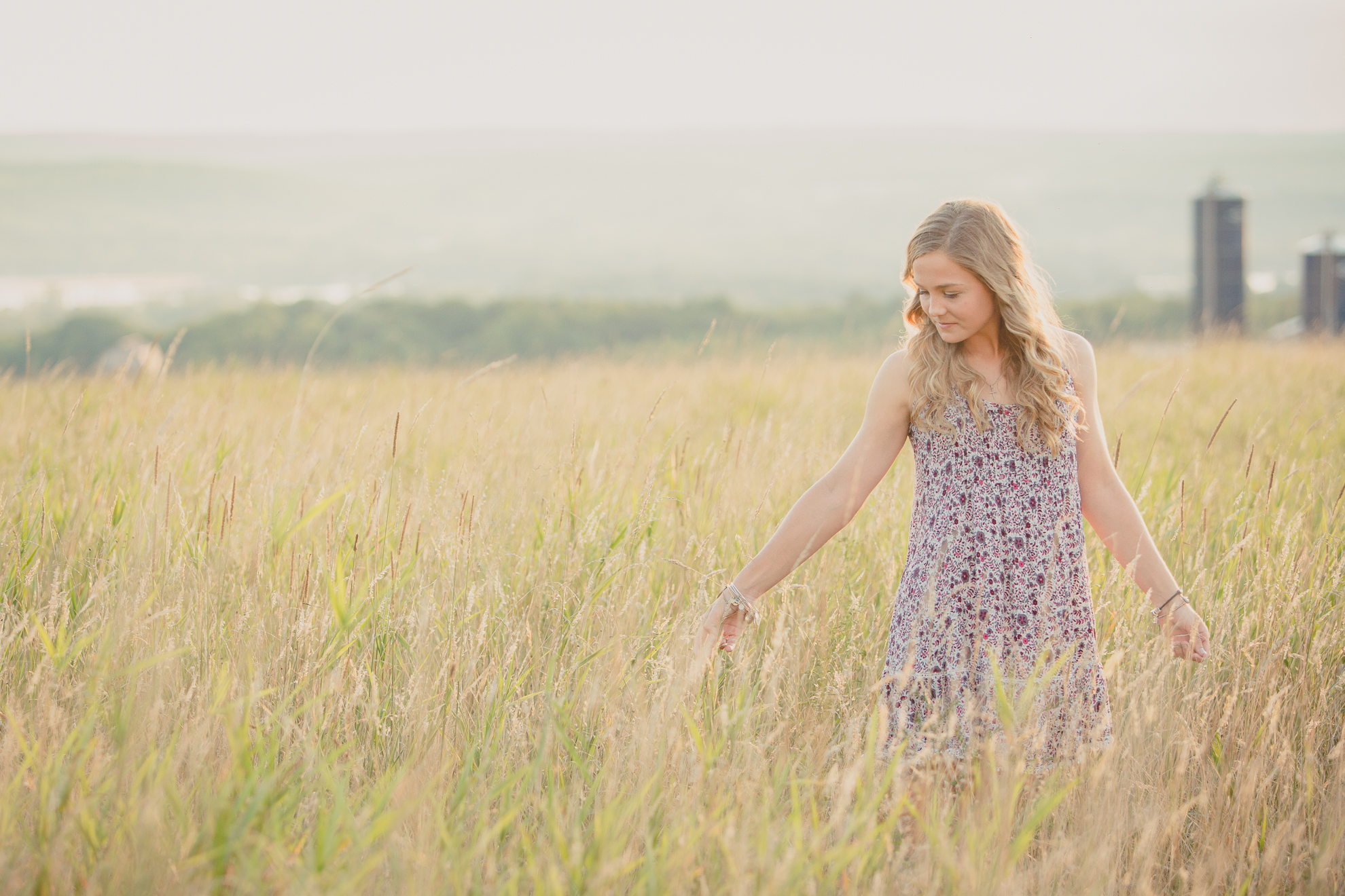 senior portrait photography of Dana in field near Buffalo, NY