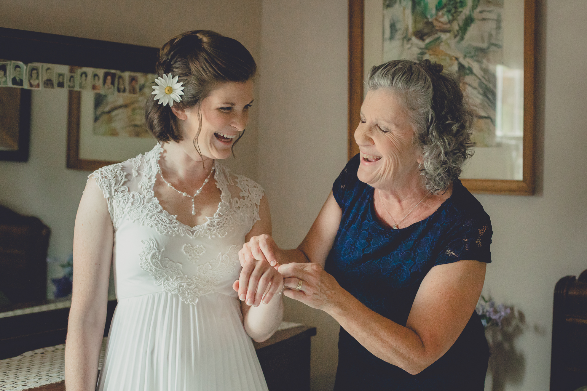 bride and mom laugh before wedding in Buffalo, NY