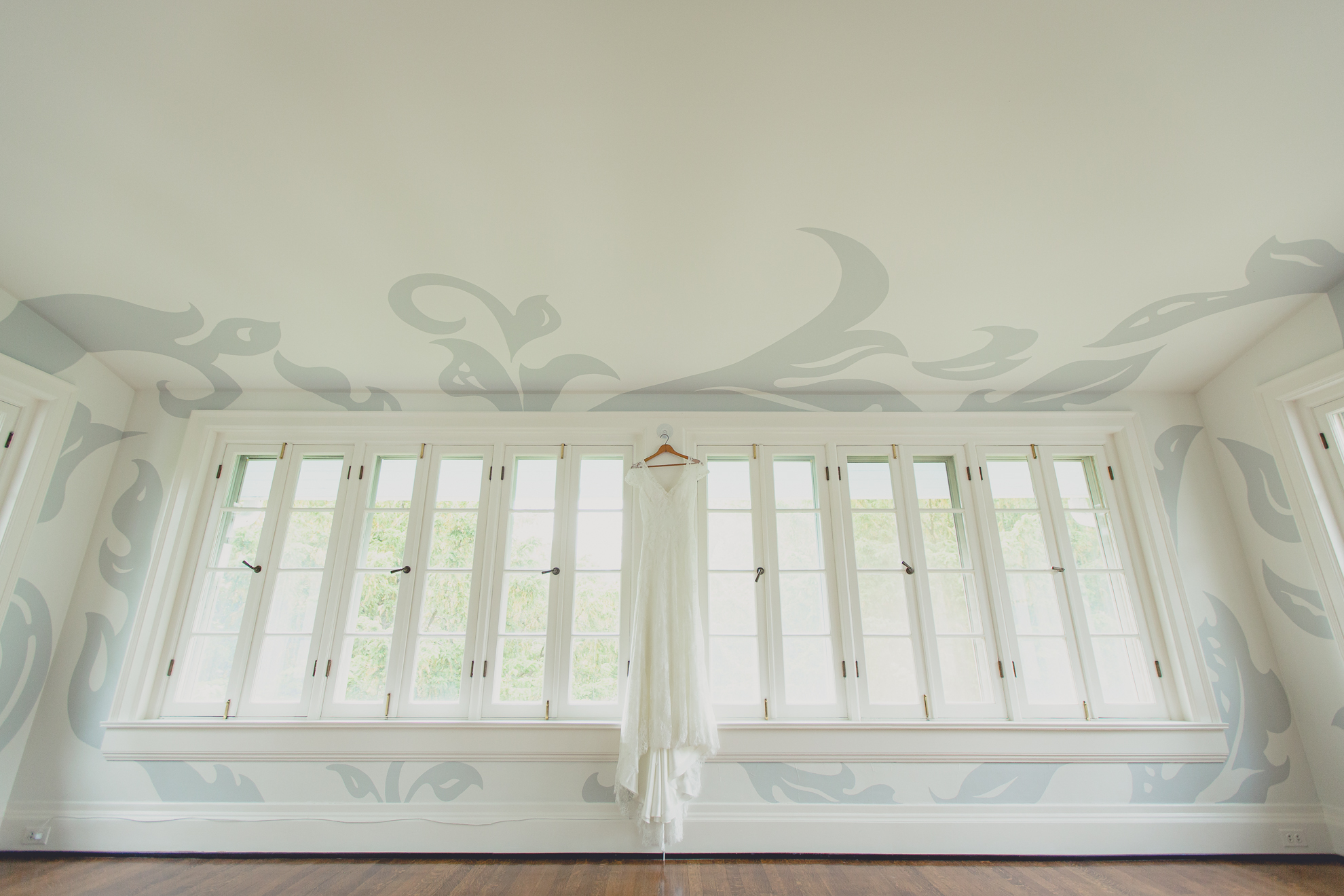 brides dress hangs in secret room at small wedding at Knox Farm near Buffalo, NY