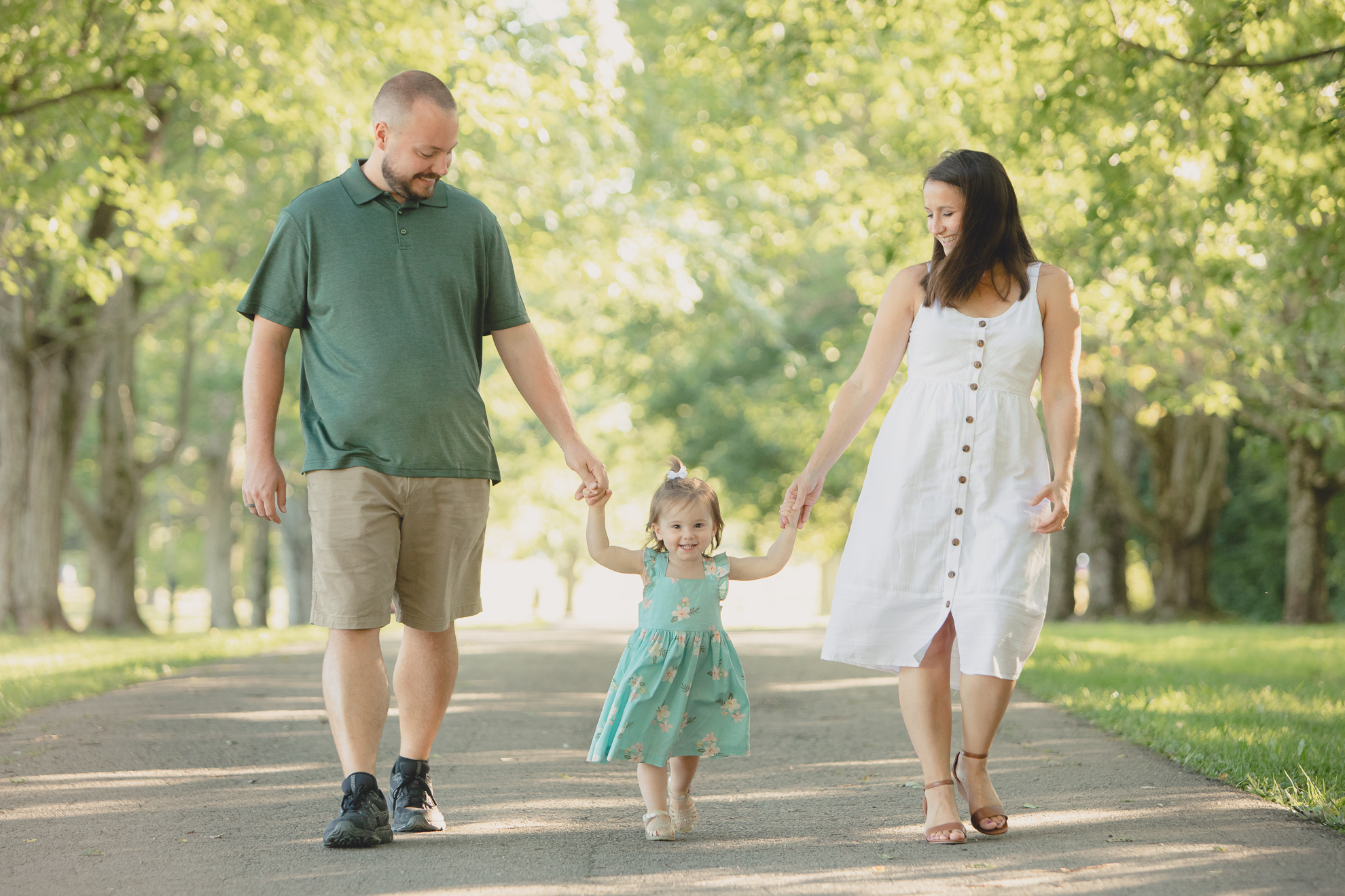 family walks on path during family portrait photography session at Knox Farm in East Aurora, a small town near Buffalo