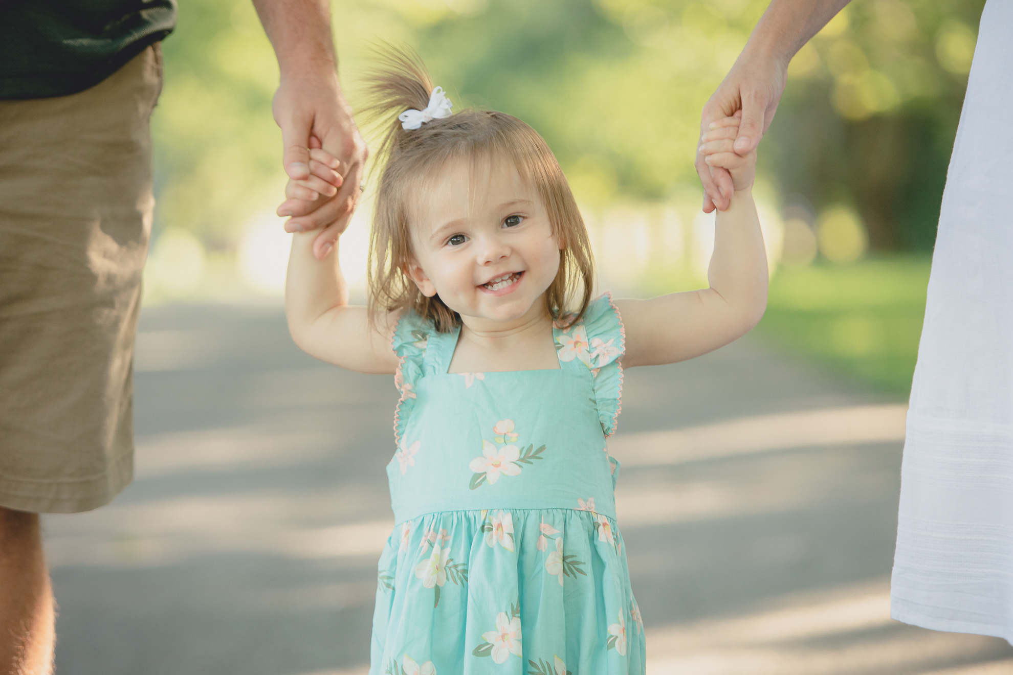 baby smiles for photographer during family portrait photography session at Knox Farm in East Aurora, a small town near Buffalo