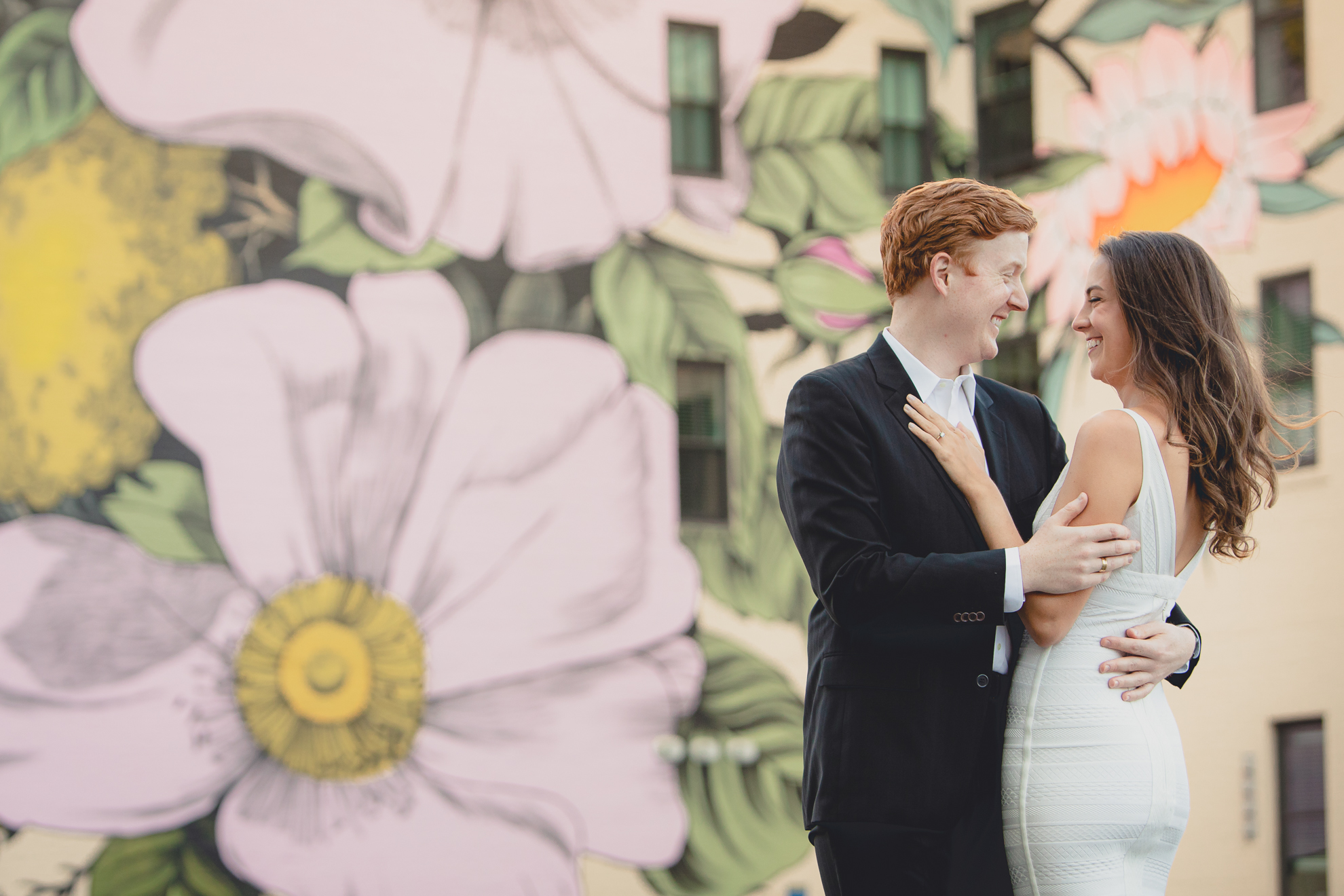 Courtney Woods and John Stevens wedding engagement portrait photography at Wildflowers for Buffalo mural in Buffalo, NY
