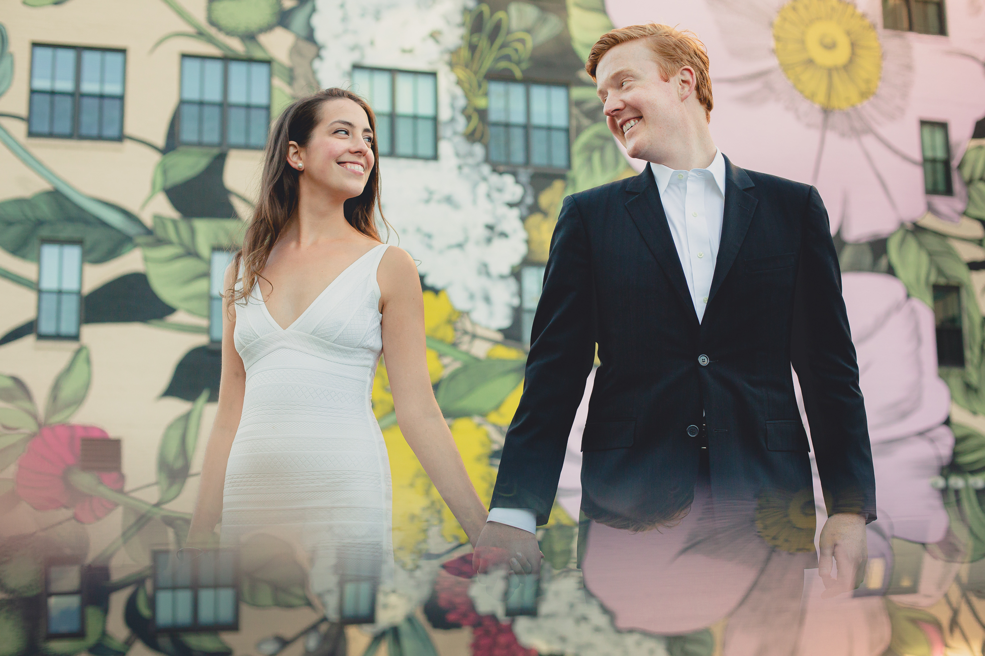 Courtney Woods and John Stevens wedding engagement portrait photography at Wildflowers for Buffalo mural in Buffalo, NY