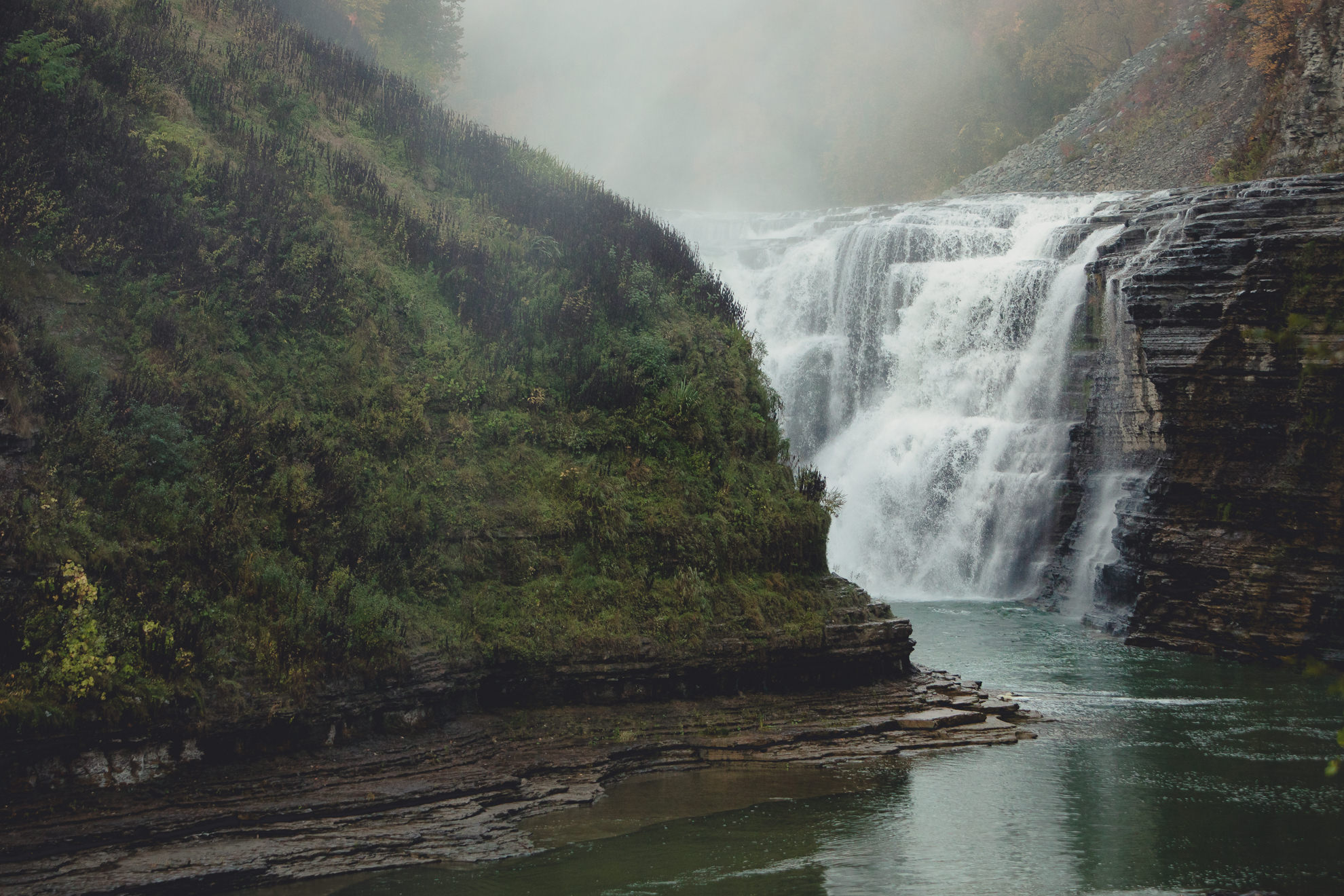 upper falls with fog during wedding engagement proposal photography session in Letchworth State Park