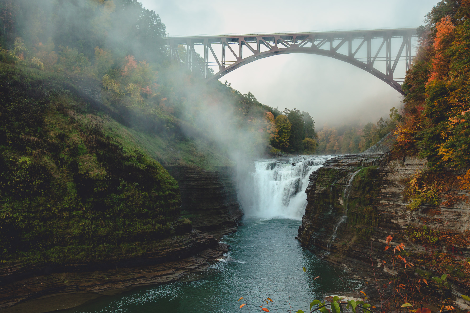 upper falls with fog during wedding engagement proposal photography session in Letchworth State Park