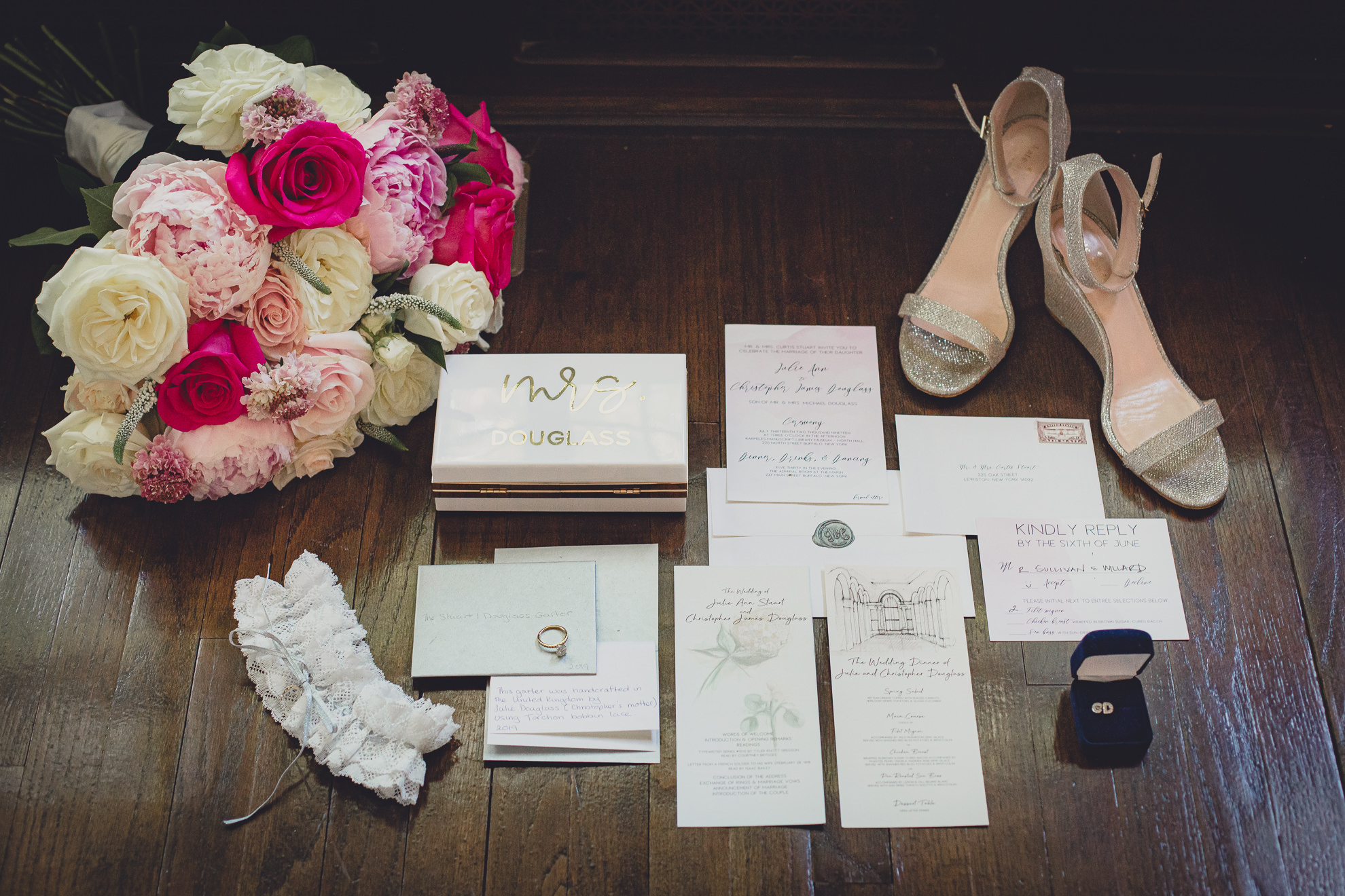 wedding invitation suite, flowers, shoes and jewelry displayed before wedding in Lewiston, NY 