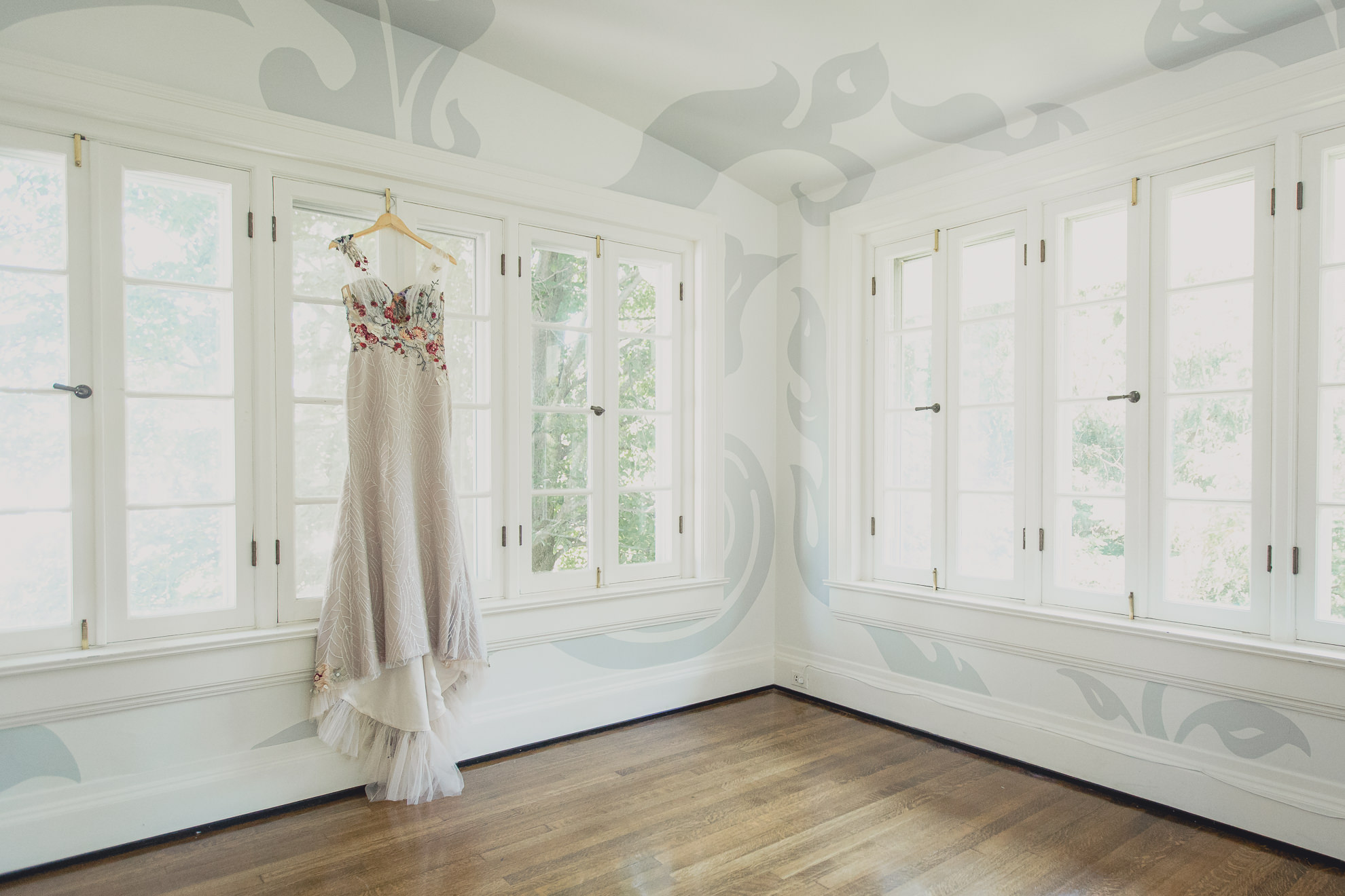 dress hangs in window of mansion in East Aurora, NY