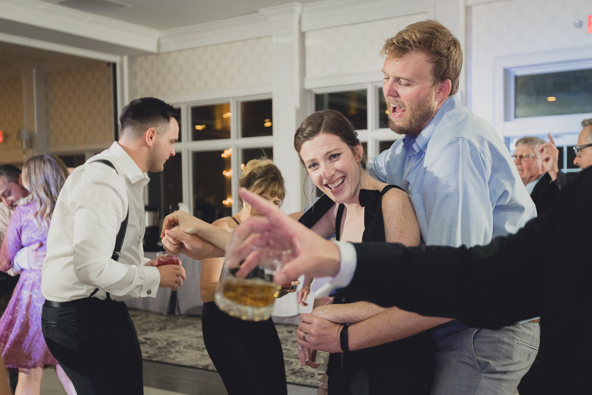 guests dance during wedding reception at the Niagara Falls Country Club