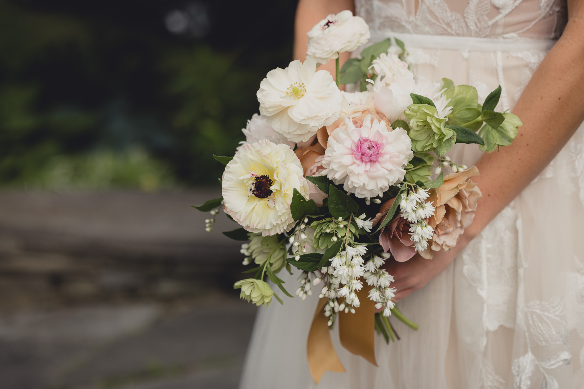 bride holds fern croft wedding bouquet at Barton Hill House in Lewiston, NY before wedding