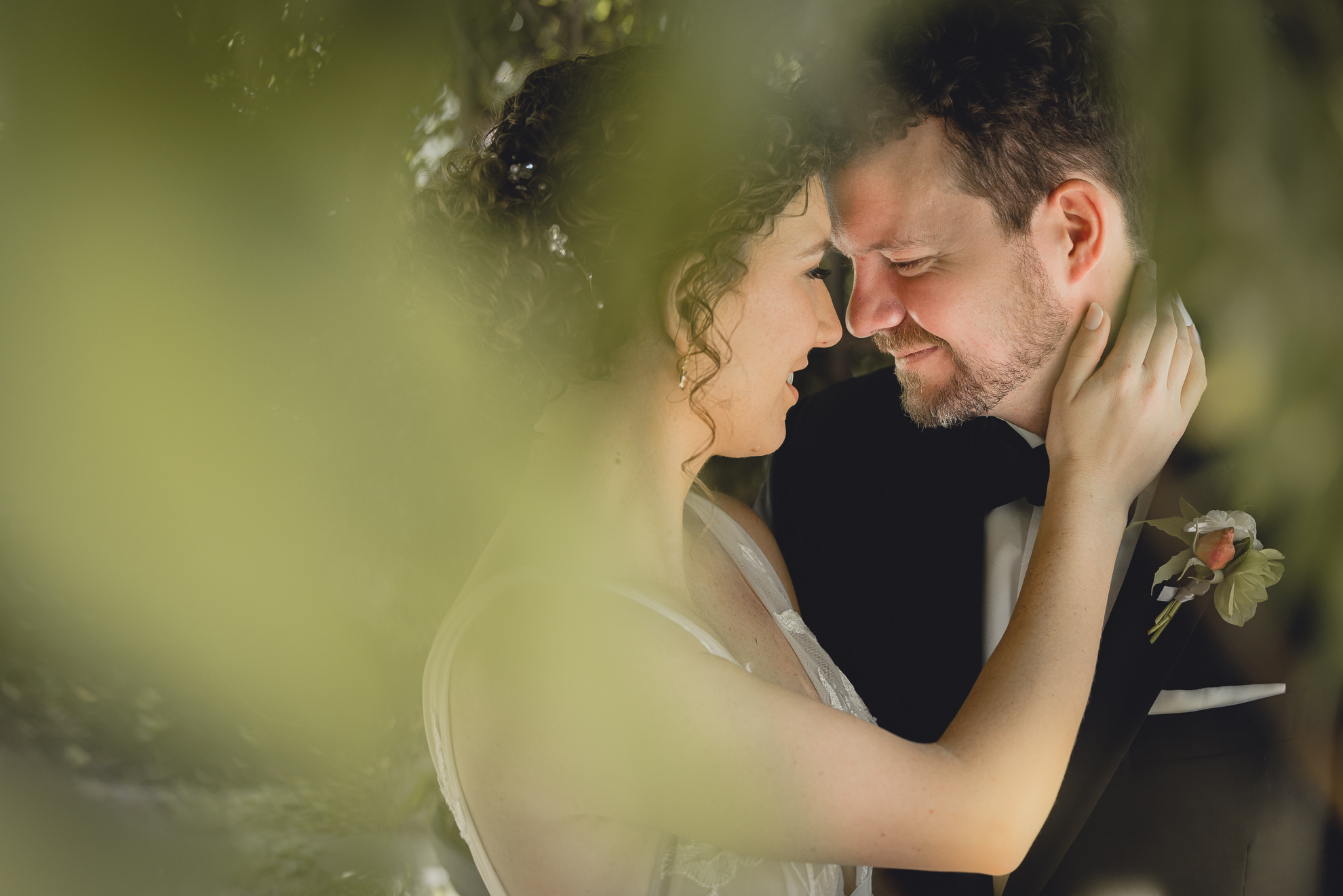bride and groom embrace at Barton Hill House in Lewiston, NY before wedding