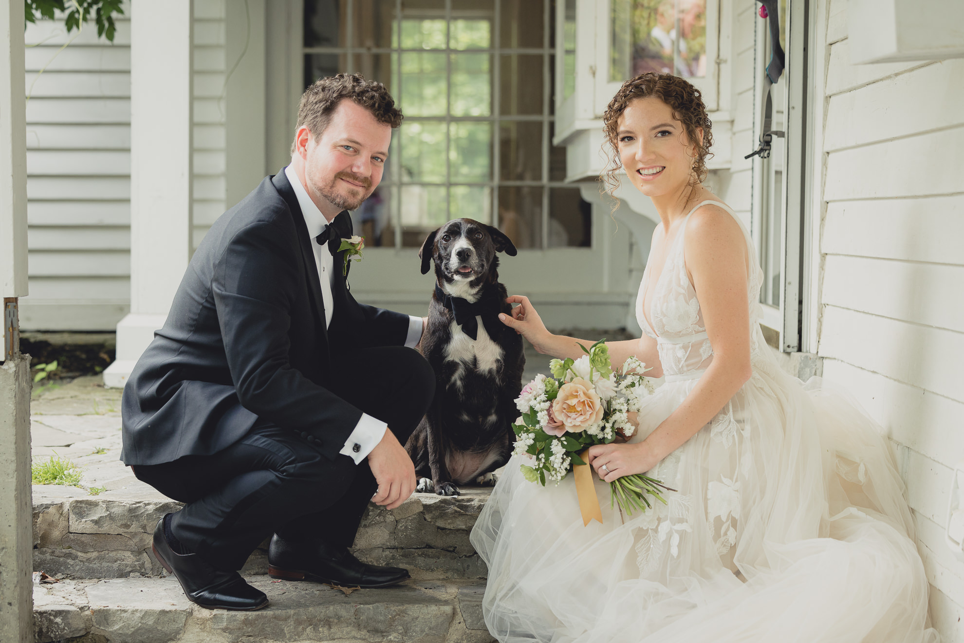 bride and groom pose with dog at Barton Hill House in Lewiston, NY before wedding