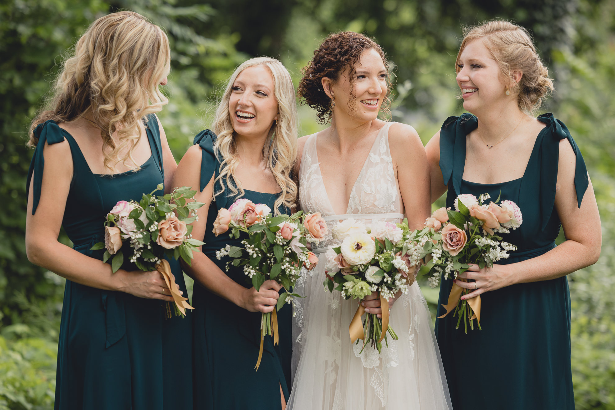 wedding party poses for portraits at Barton Hill House in Lewiston, NY before wedding