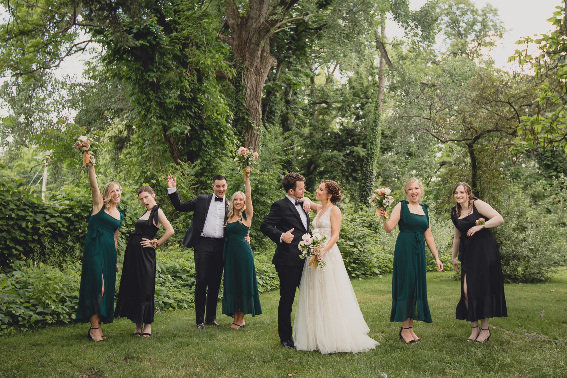 wedding party poses for portraits at Barton Hill House in Lewiston, NY before wedding