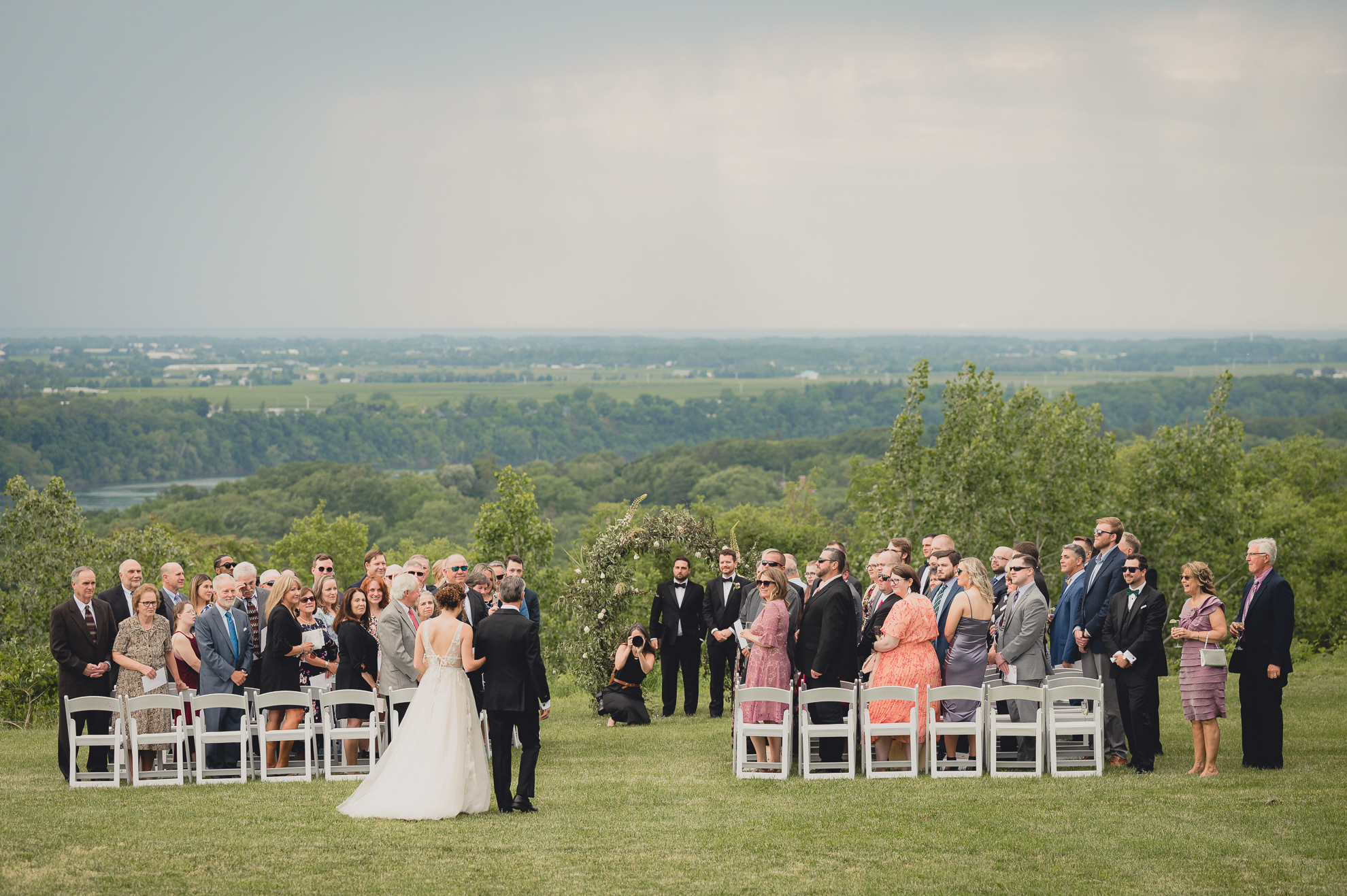 bride and father walk down the aisle during wedding ceremony at the Niagara Falls Country Club