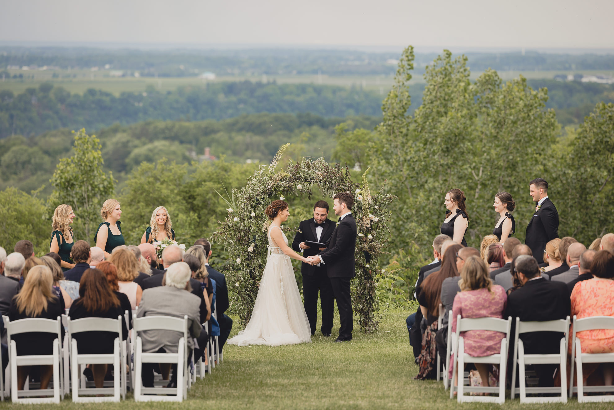 bride and groom say vows during wedding ceremony at the Niagara Falls Country Club