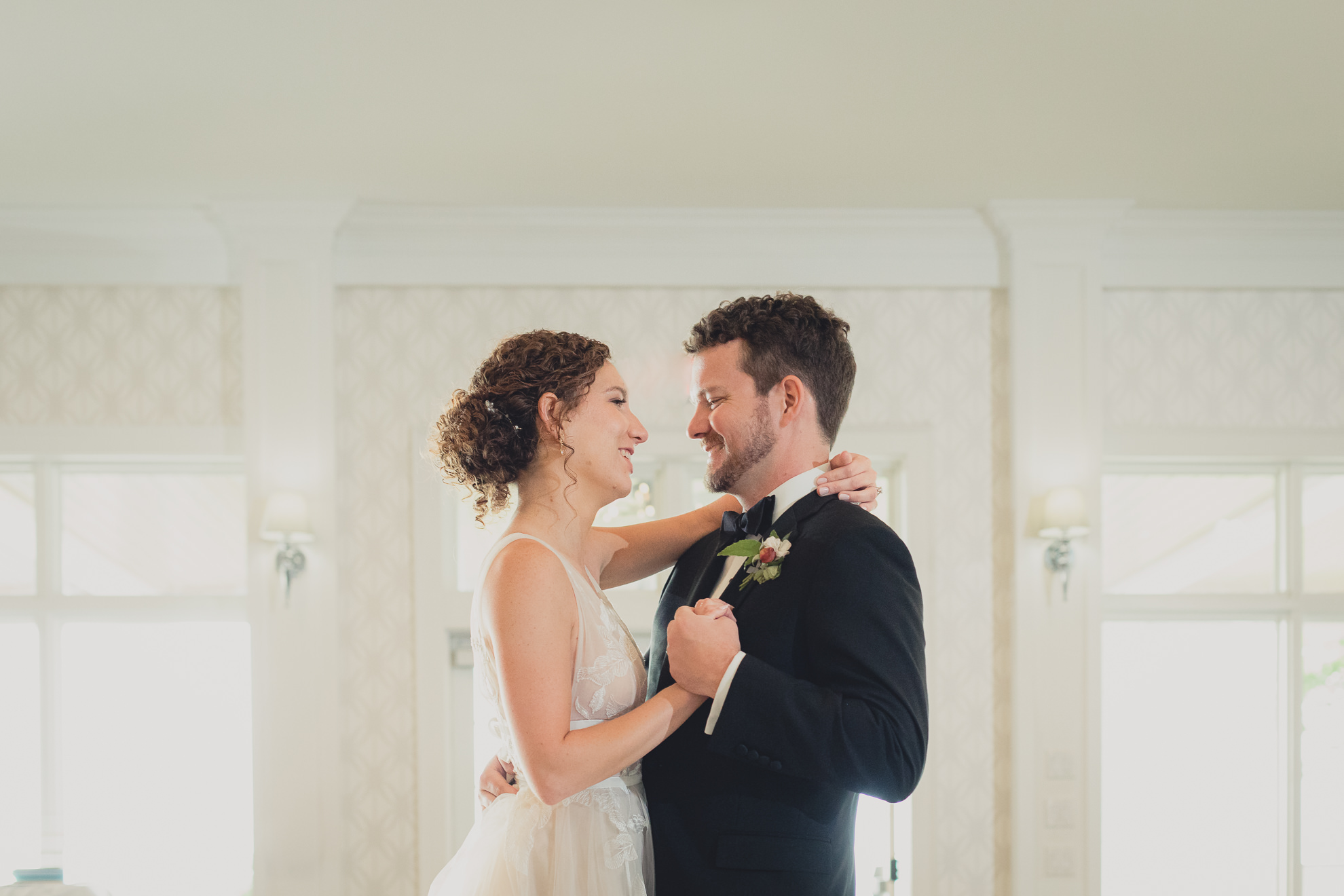 bride and groom dance during wedding reception at the Niagara Falls Country Club