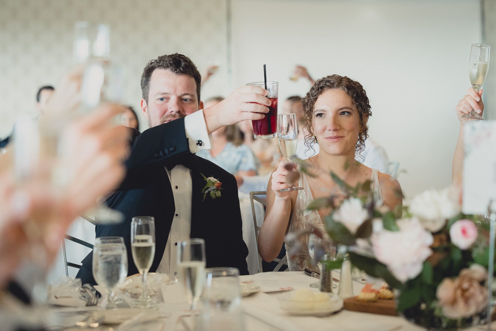 bride and groom toast during wedding reception at the Niagara Falls Country Club