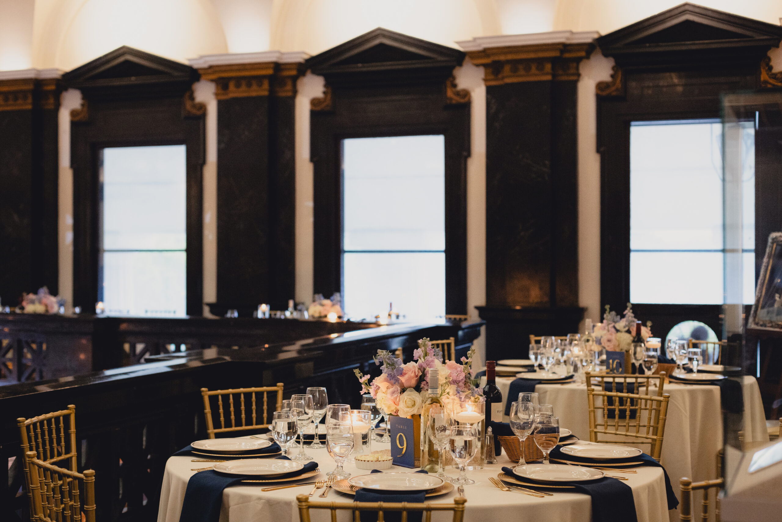 table settings seen on mezzanine  during wedding reception at the Buffalo History Museum