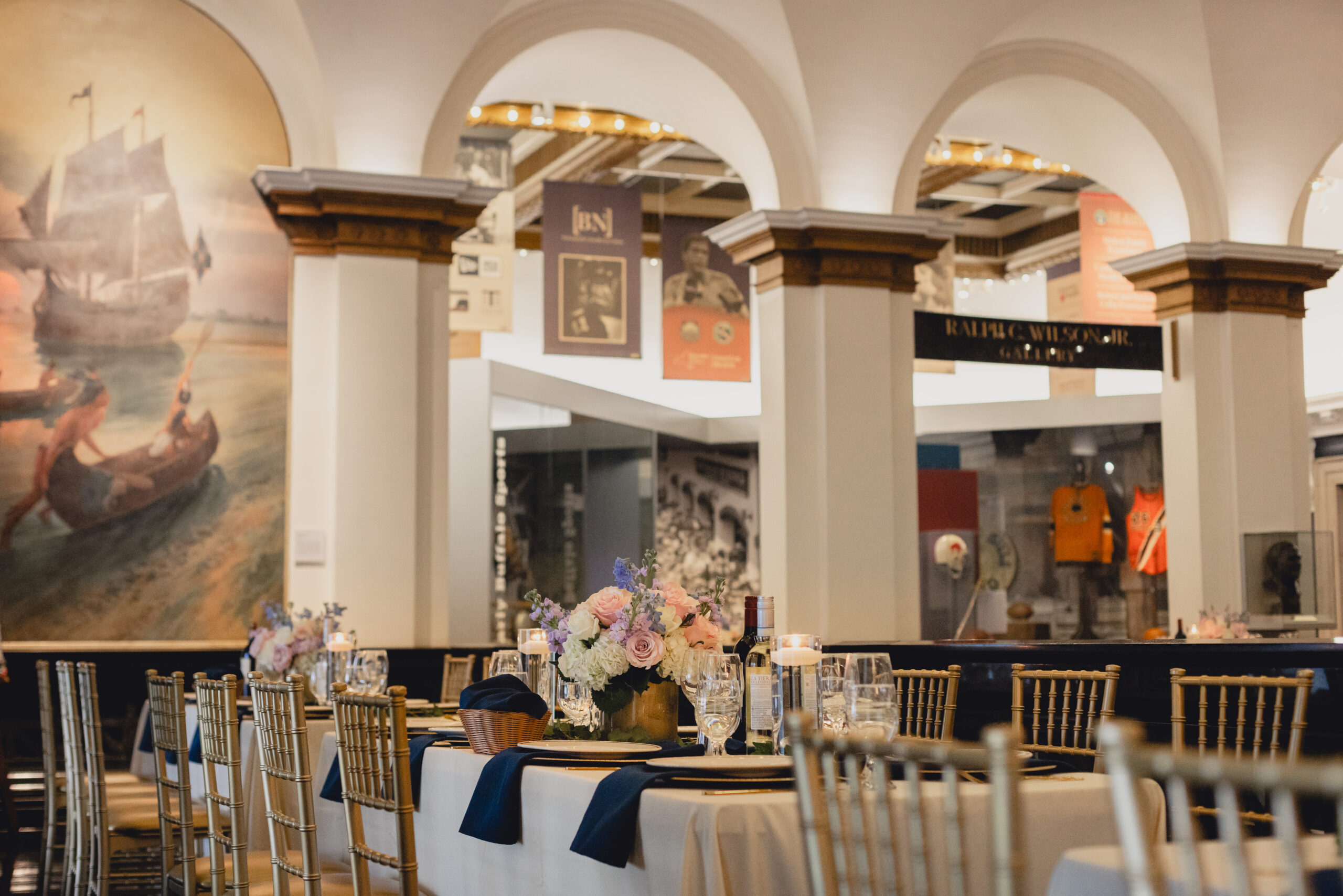 table settings seen on mezzanine  during wedding reception at the Buffalo History Museum