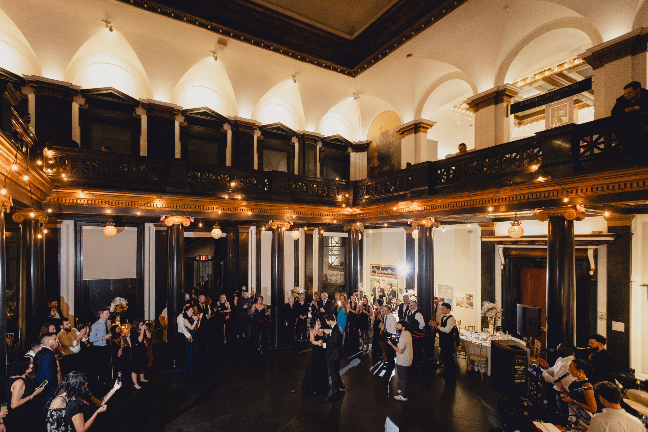 groom dances with mom during wedding reception at the Buffalo History Museum