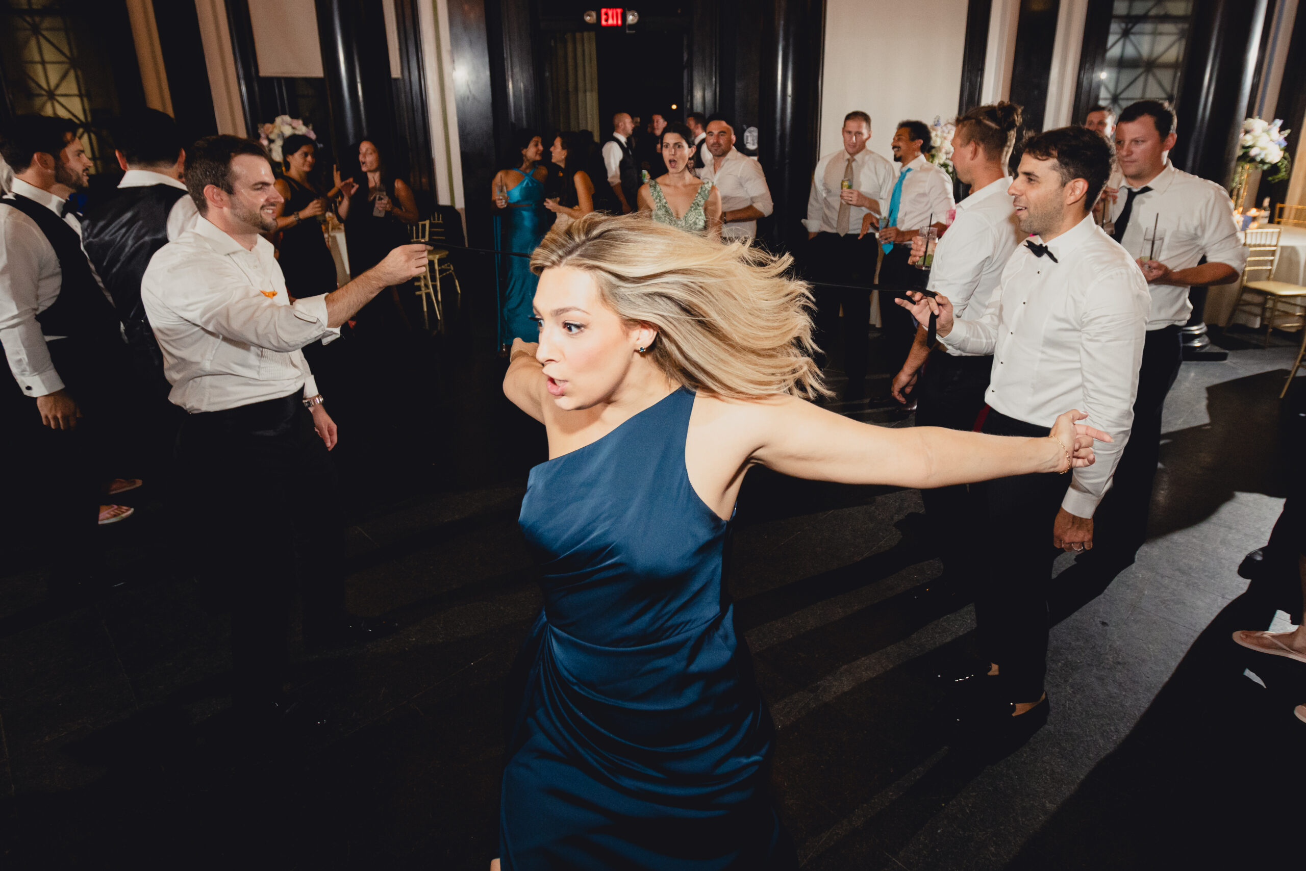 guest limbos during wedding reception at the Buffalo History Museum