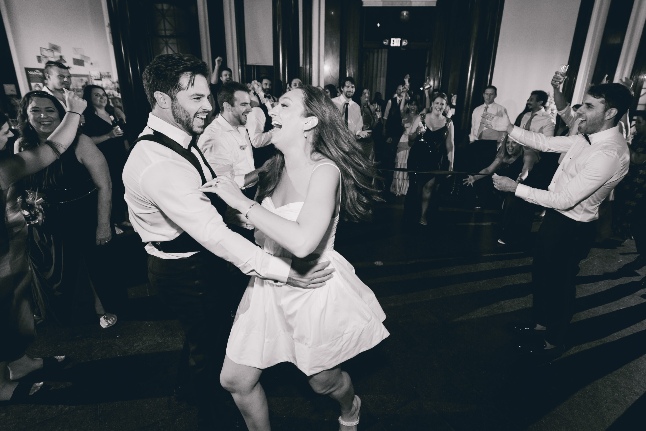 bride and groom laugh while dancing during wedding reception at the Buffalo History Museum