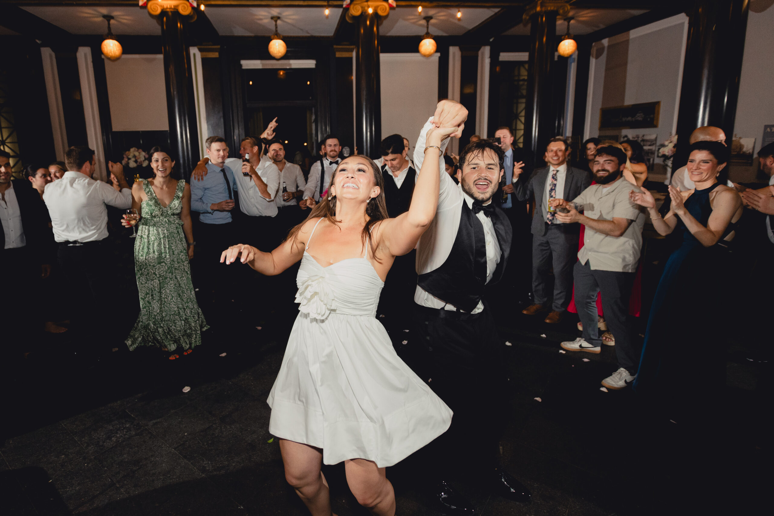 bride and groom spin on dance floor during wedding reception at the Buffalo History Museum