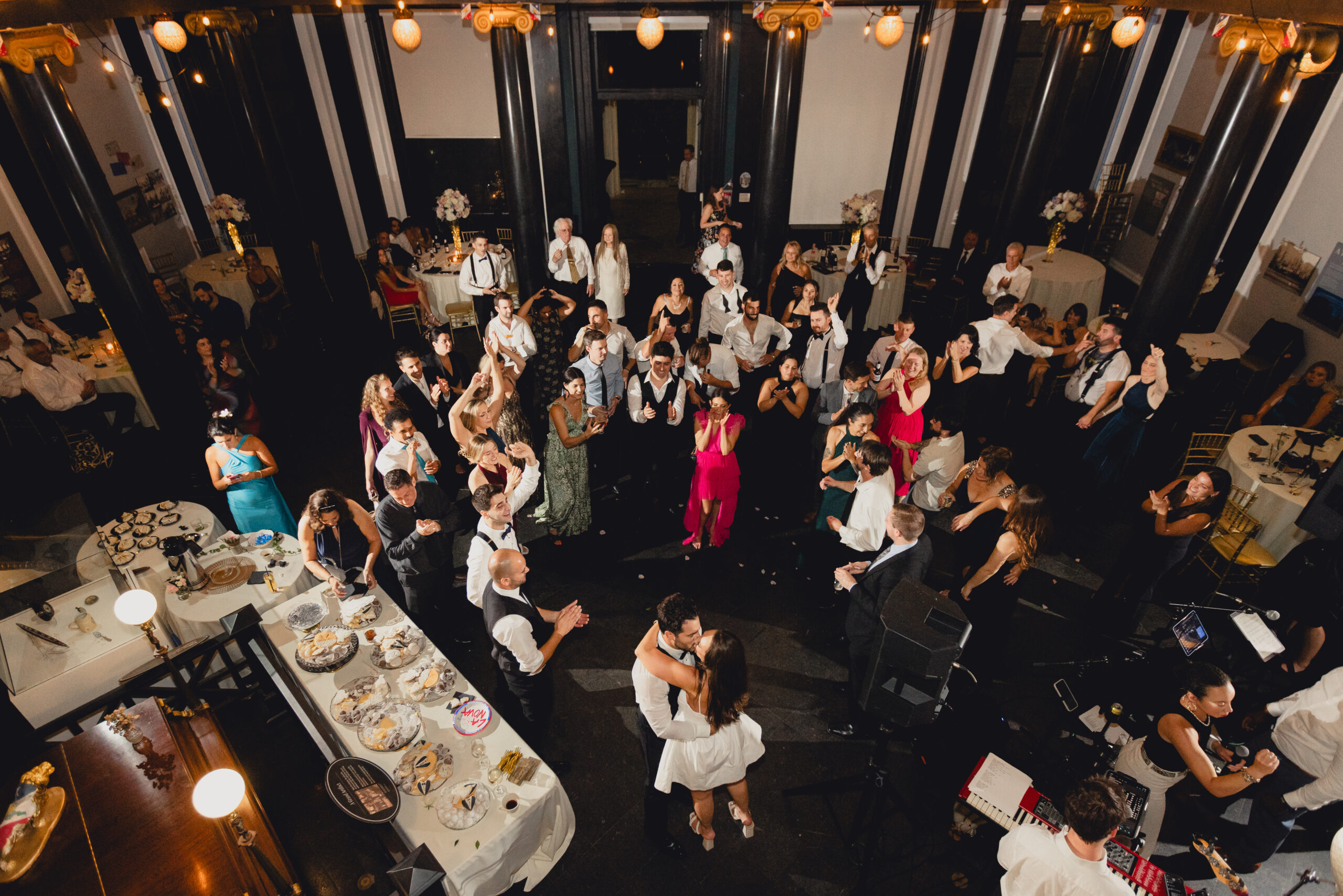 guest cheer for bride and groom during wedding reception at the Buffalo History Museum