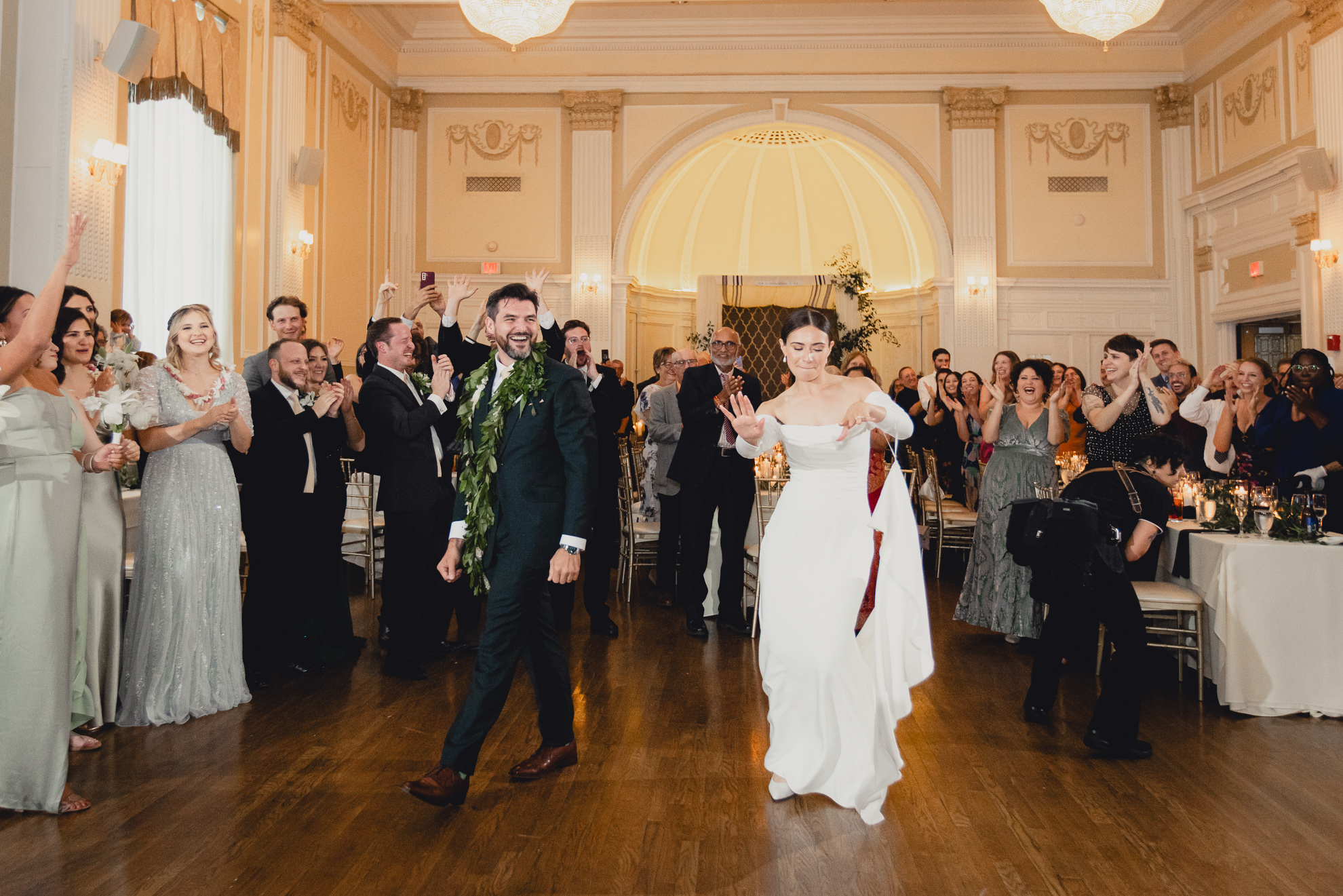bride and groom celebrate after introductions during wedding reception at the Hotel Lafayette in Buffalo, NY