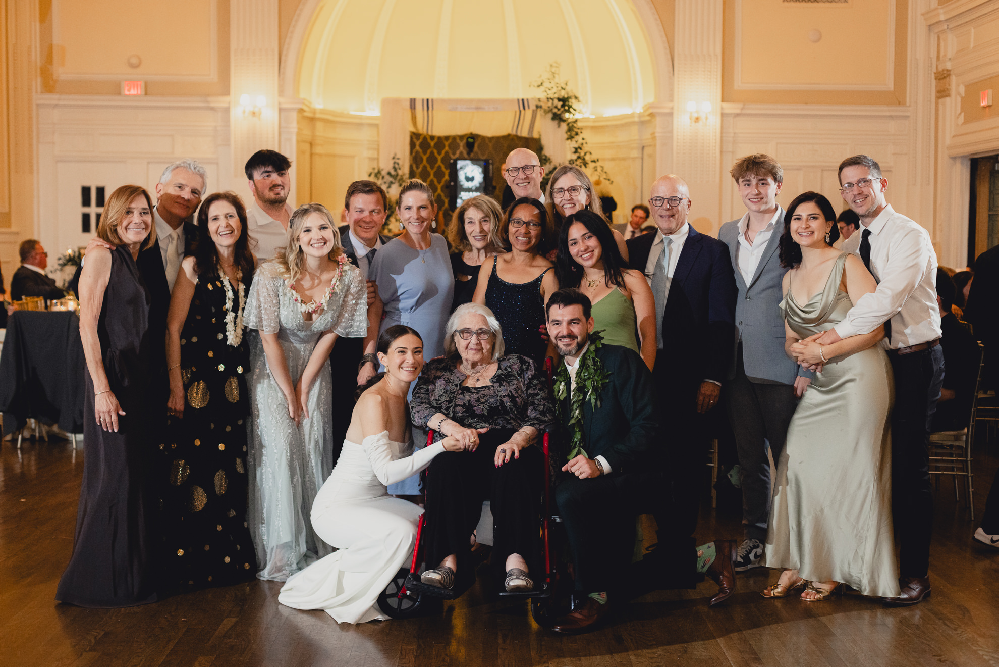 family poses for portrait on dance floor during wedding reception at the Hotel Lafayette in Buffalo, NY