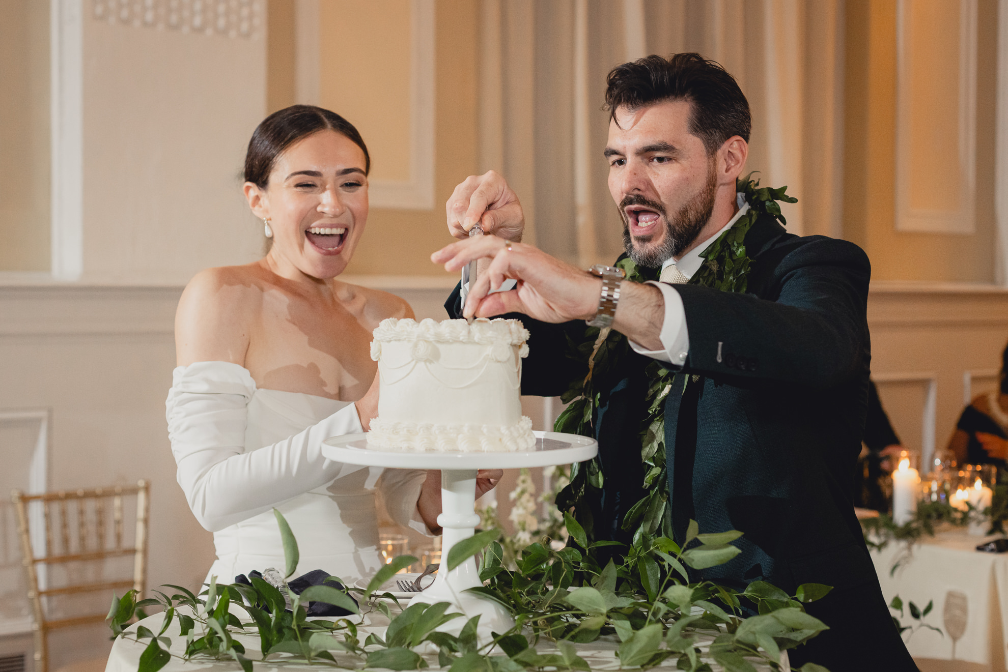 bride and groom cut cake during wedding reception at the Hotel Lafayette in Buffalo, NY