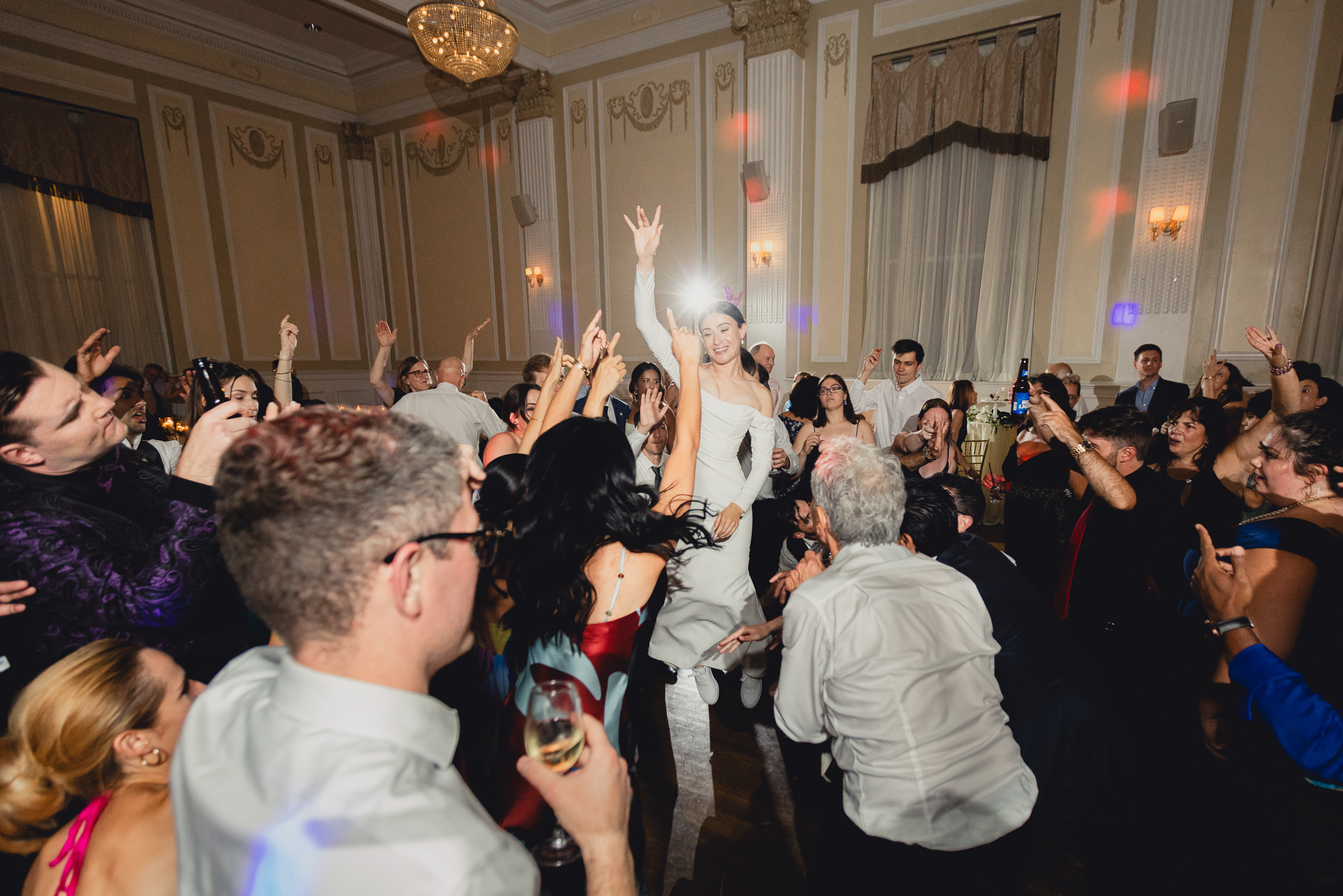 bride jumps on dance floor during wedding reception at the Hotel Lafayette in Buffalo, NY