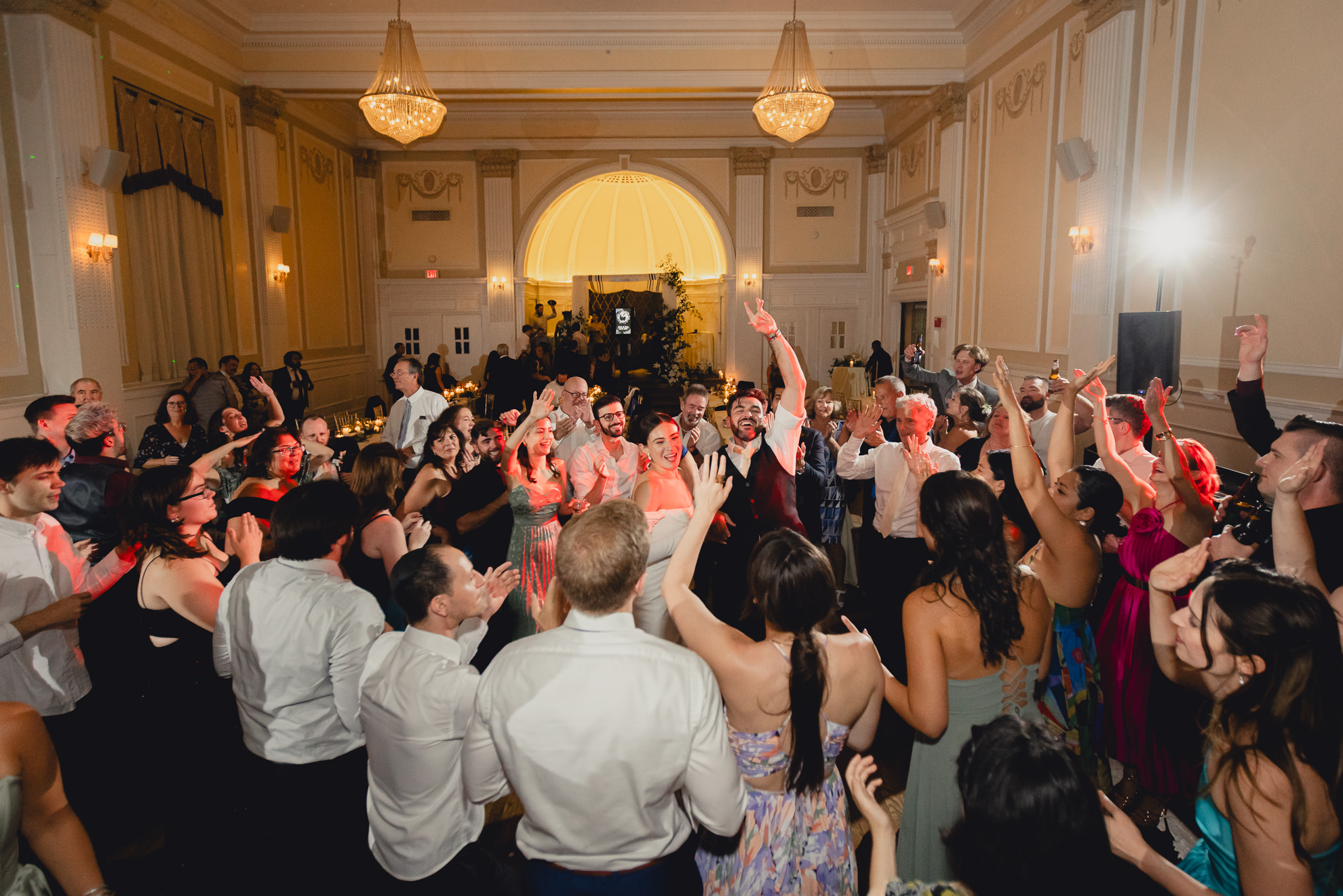 bride and groom cheer on dance floor during wedding reception at the Hotel Lafayette in Buffalo, NY