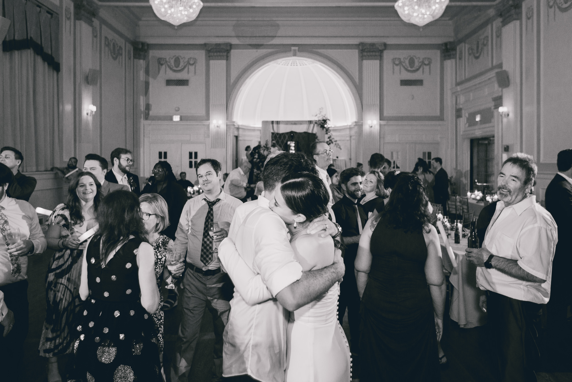 bride and groom hug on dance floor during wedding reception at the Hotel Lafayette in Buffalo, NY