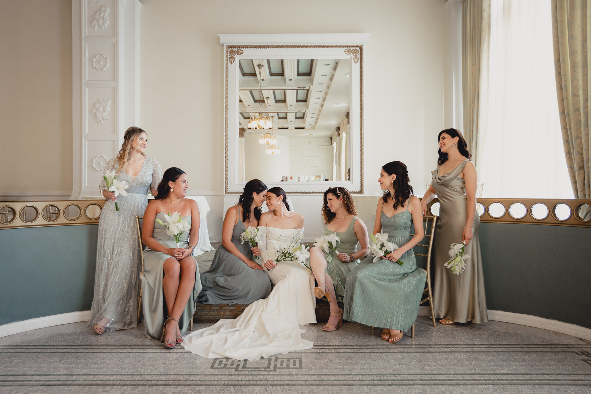 bridesmaids pose for portrait in Crystal Ballroom at the Hotel Lafayette in Buffalo, NY