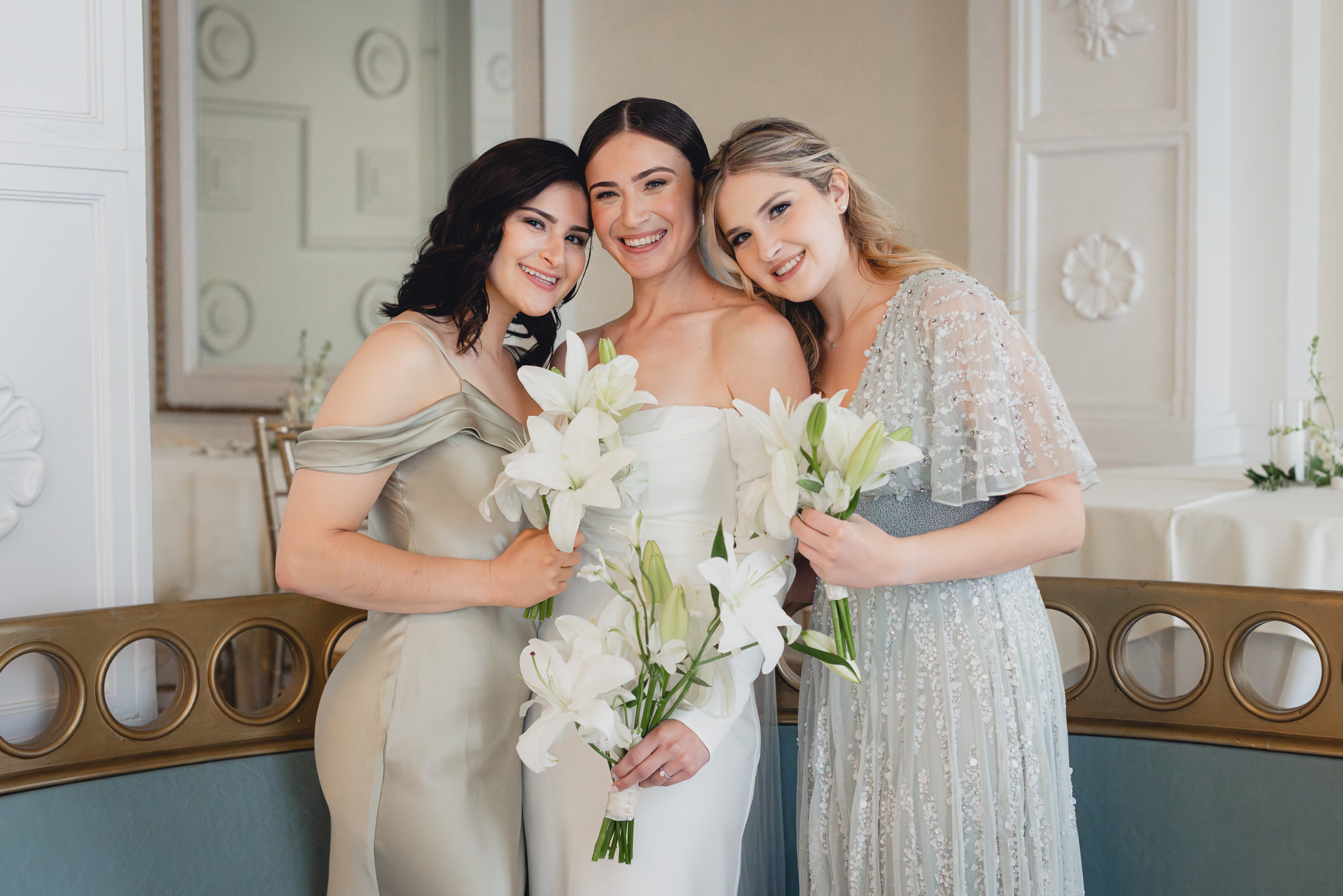 bride and sisters pose for portrait in Crystal ballroom in Buffalo, NY