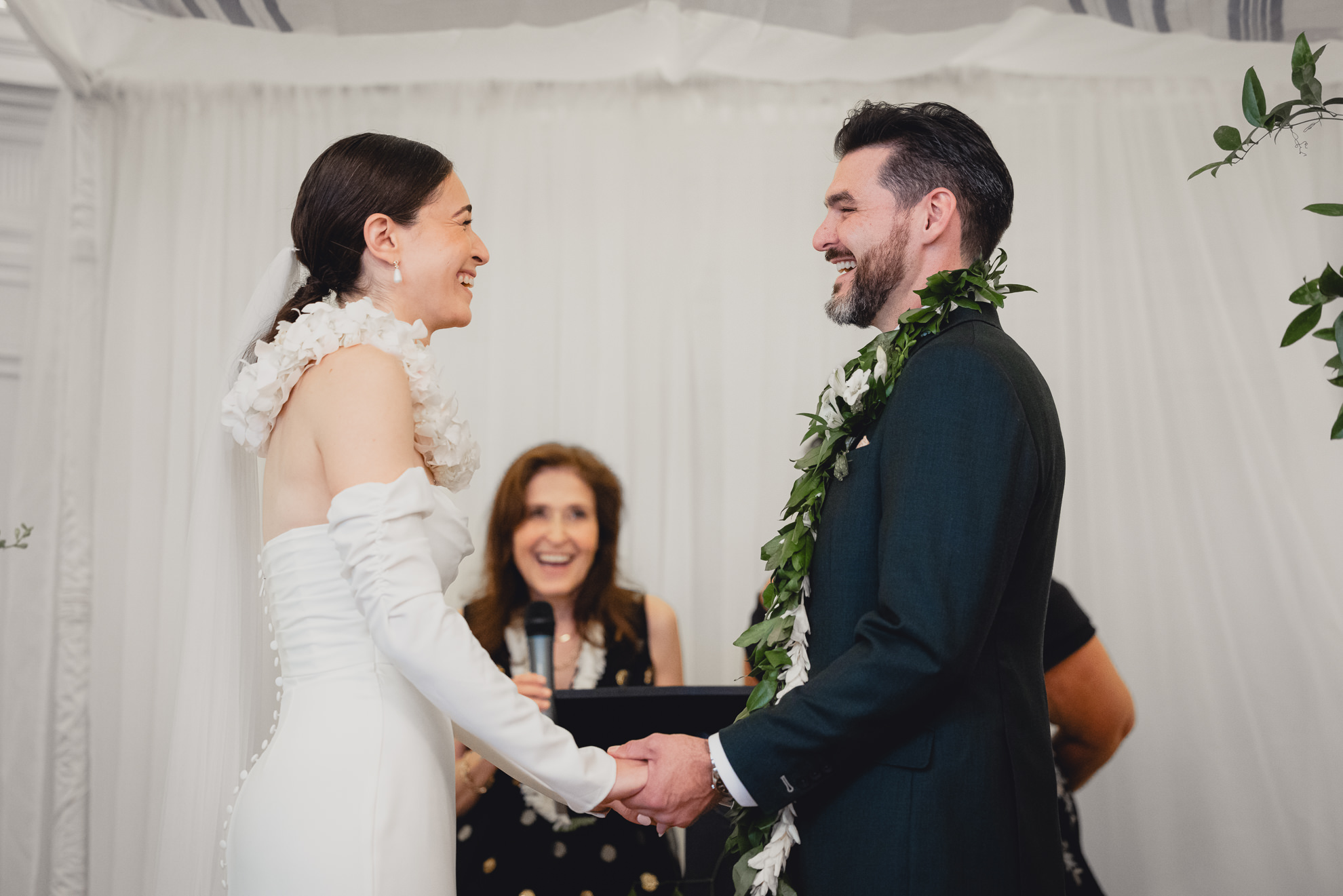 bride and groom smile during vows during wedding ceremony in the Golden Ballroom of the Hotel Lafayette