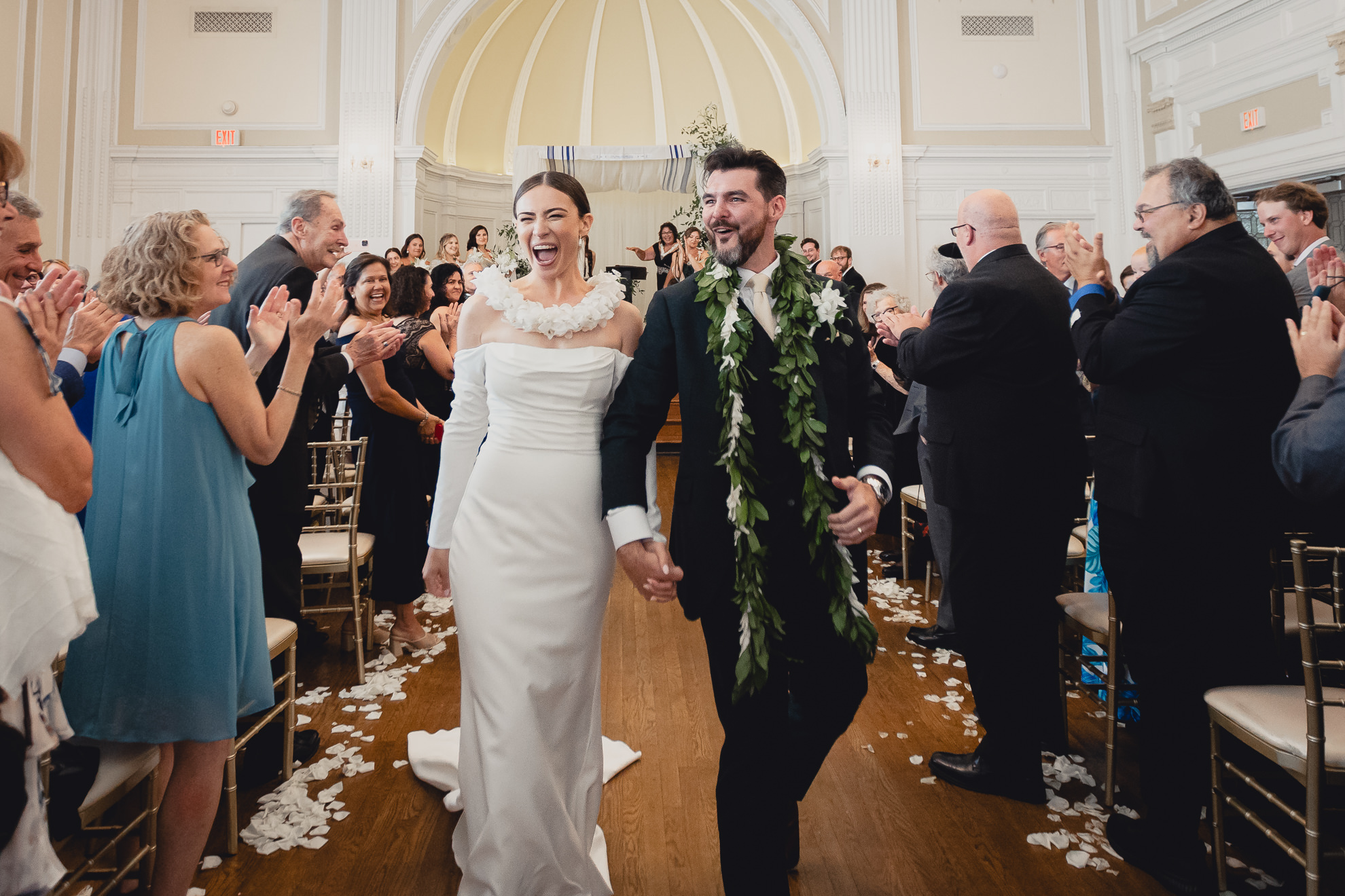 bride and groom recess down aisle after wedding ceremony in the Golden Ballroom of the Hotel Lafayette