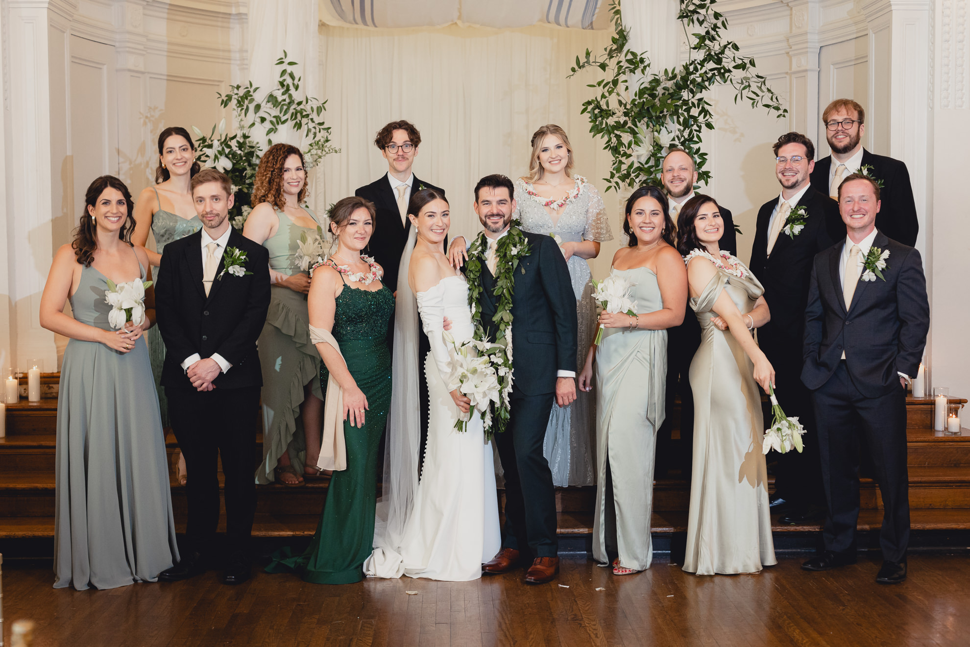 wedding party poses for portrait in Golden Ballroom