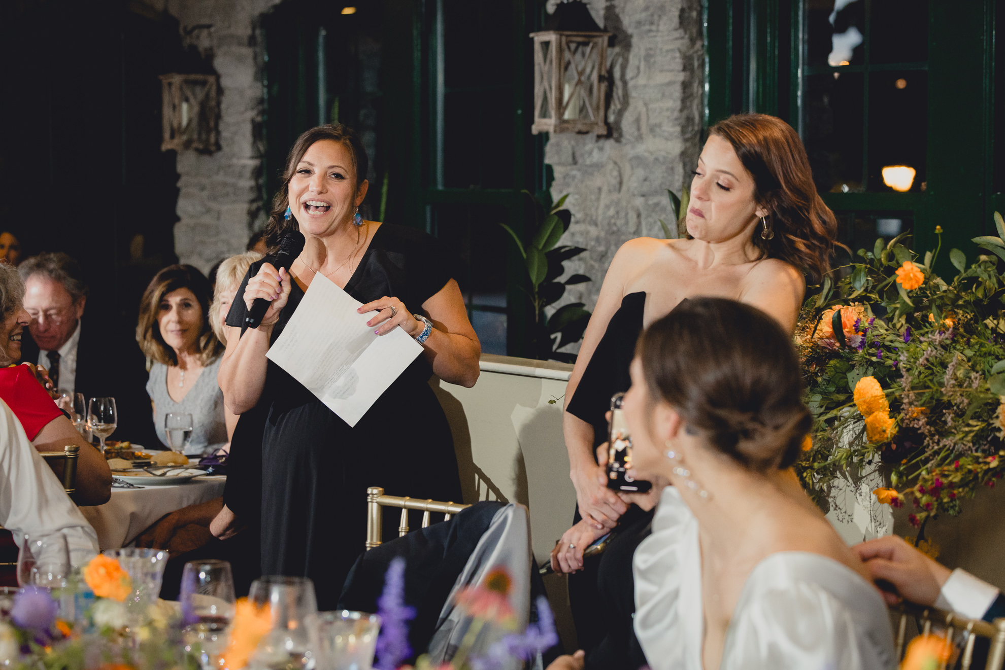 bridesmaids deliver speech  during wedding reception at the Terrace at Marcy Casino in Buffalo, NY