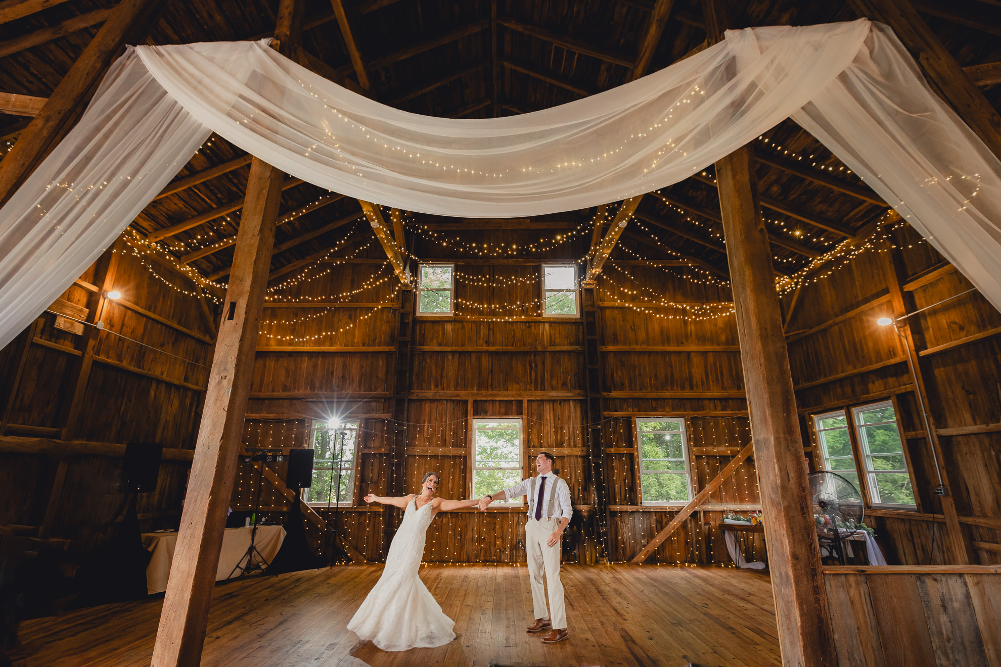 bride and groom dance during wedding reception at The Gallagher Barn in Medina, NY