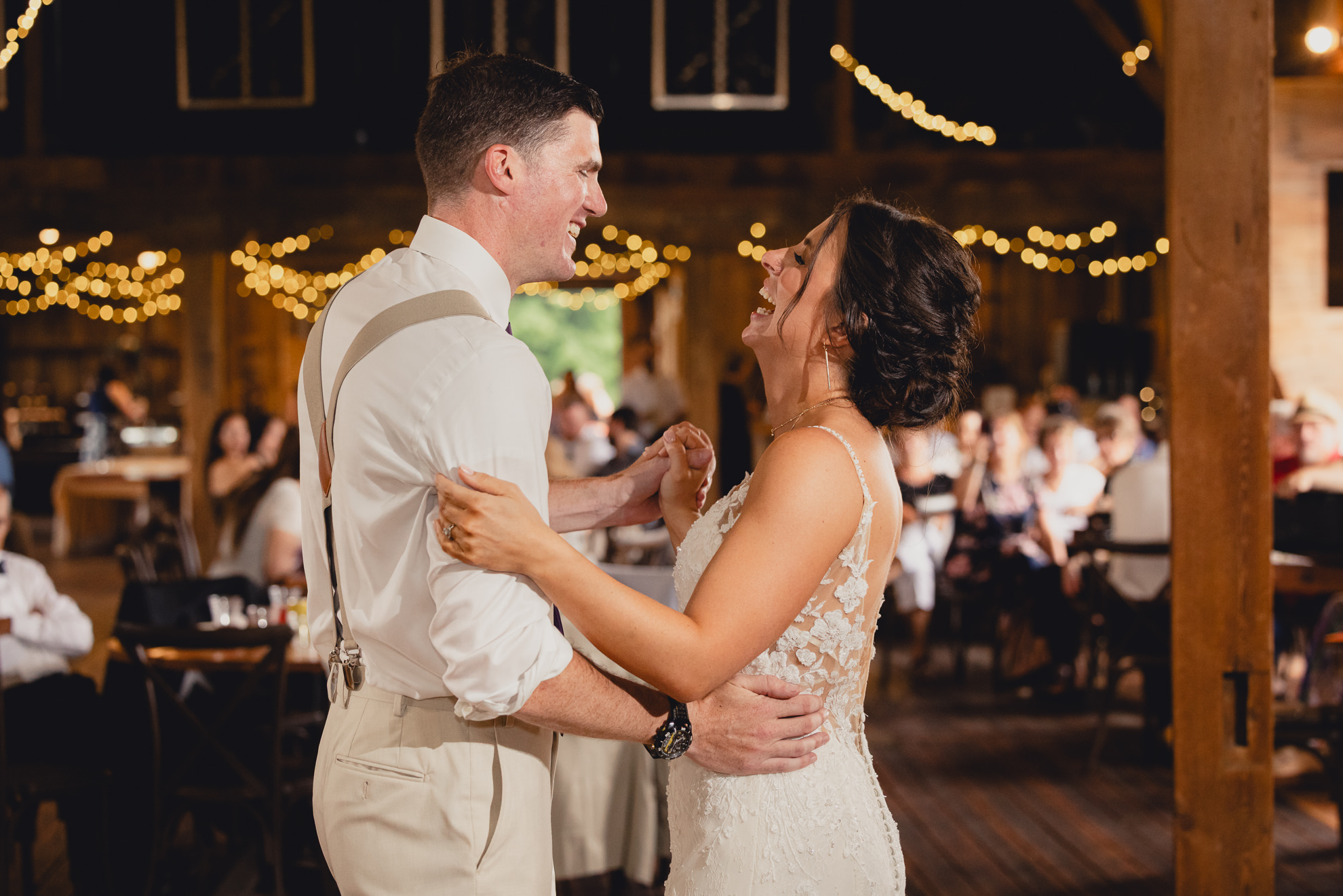 bride and groom dance during wedding reception at The Gallagher Barn in Medina, NY