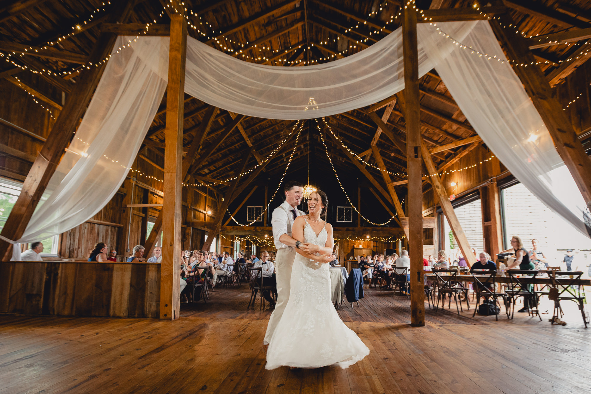 bride and groom dance during wedding reception at The Gallagher Barn in Medina, NY
