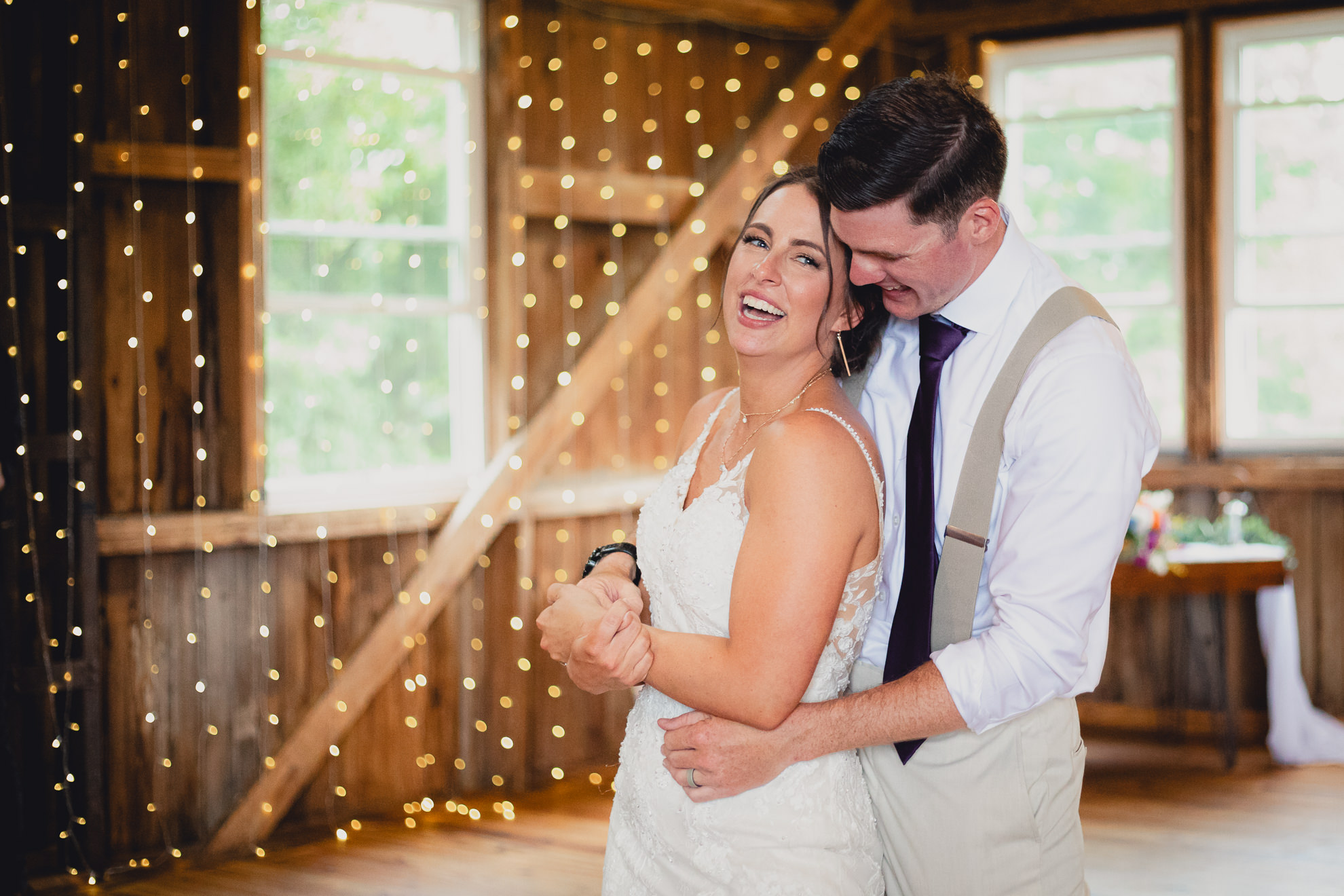 bride and groom dance during wedding reception at The Gallagher Barn in Medina, NY